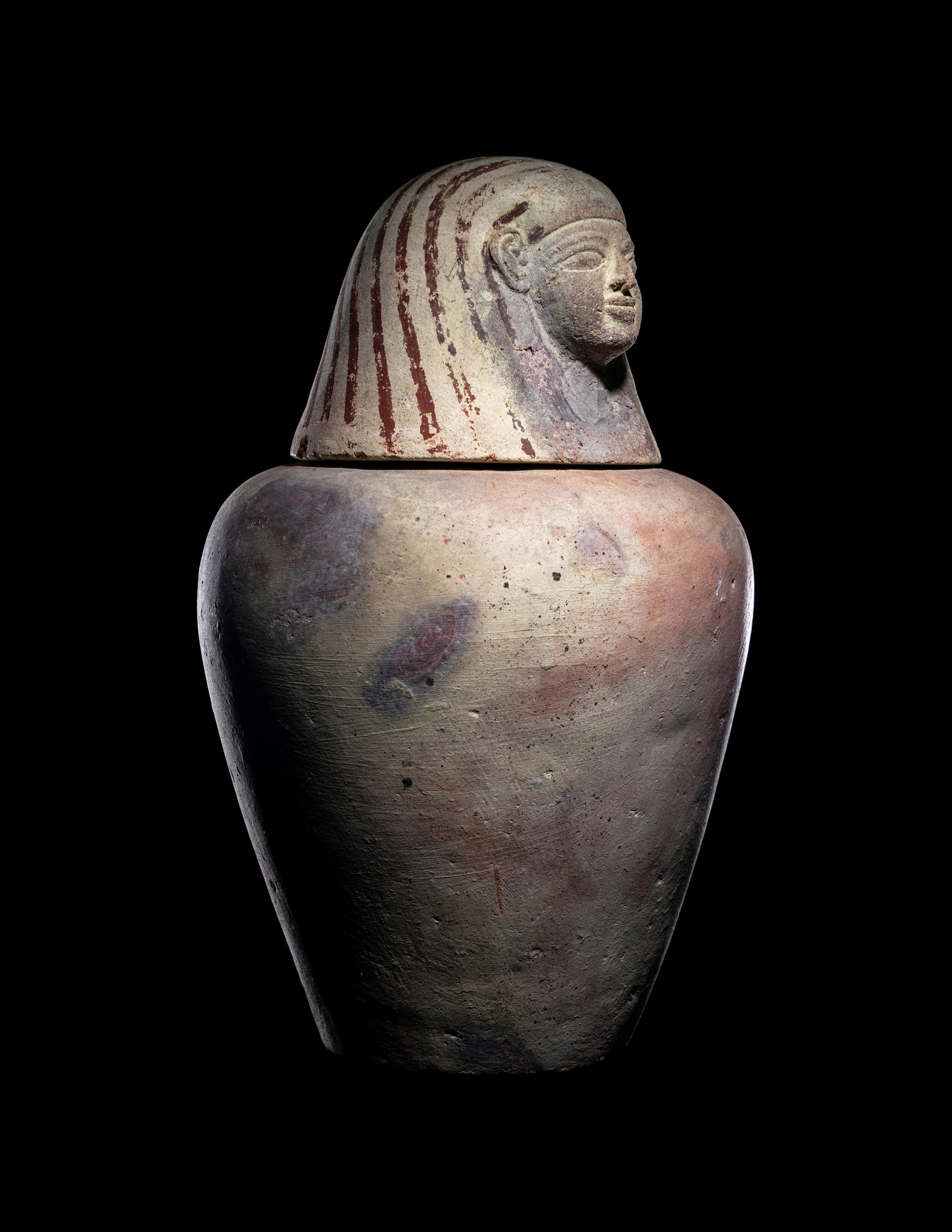 An Egyptian Painted Pottery Canopic Jar