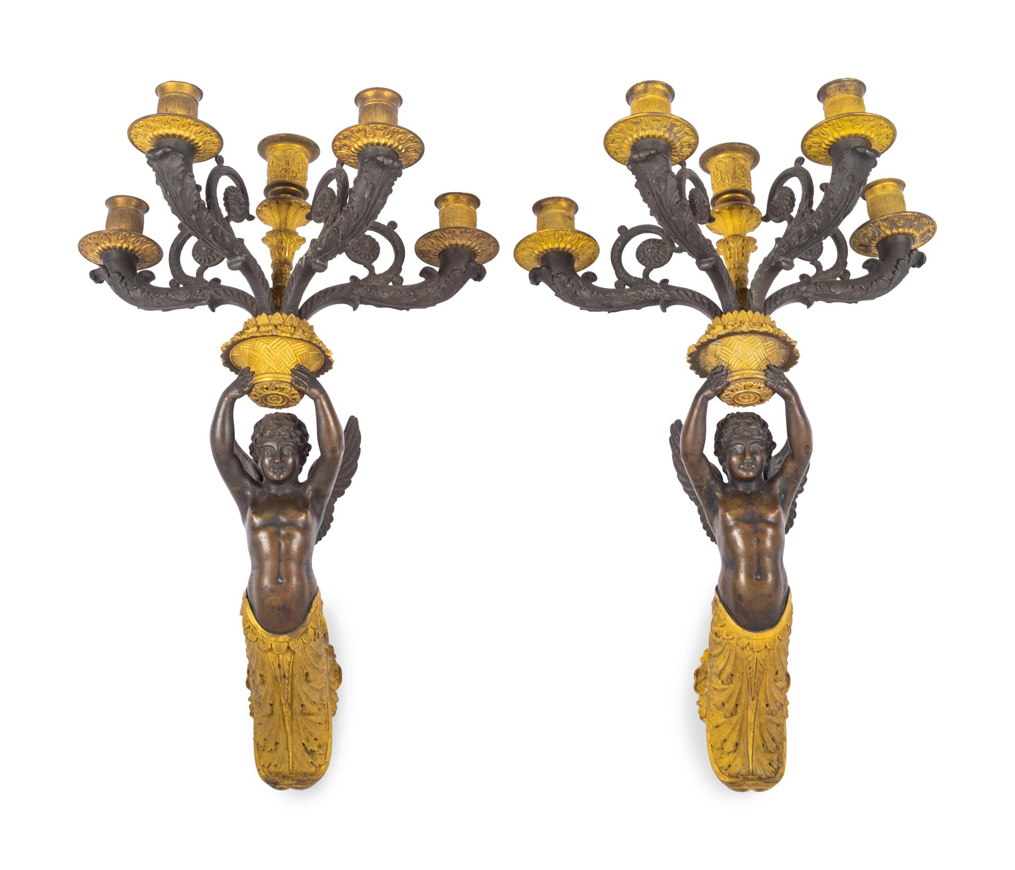 A Pair of Empire Style Gilt and Patinated Bronze Figural Five-Light Sconces
