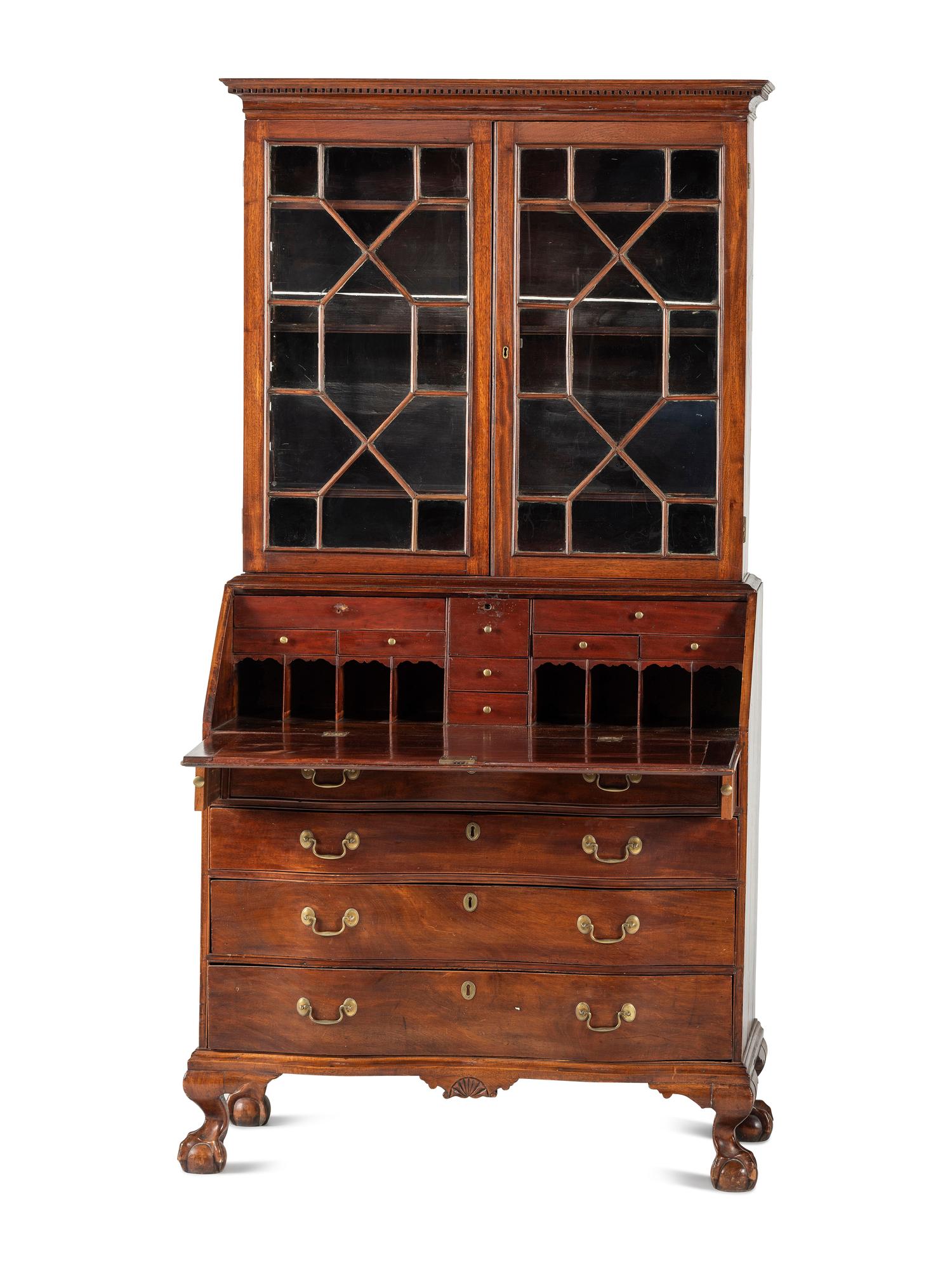 A Chippendale Mahogany and Cherrywood Serpentine Claw-and-Ball Foot Desk-and-Bookcase