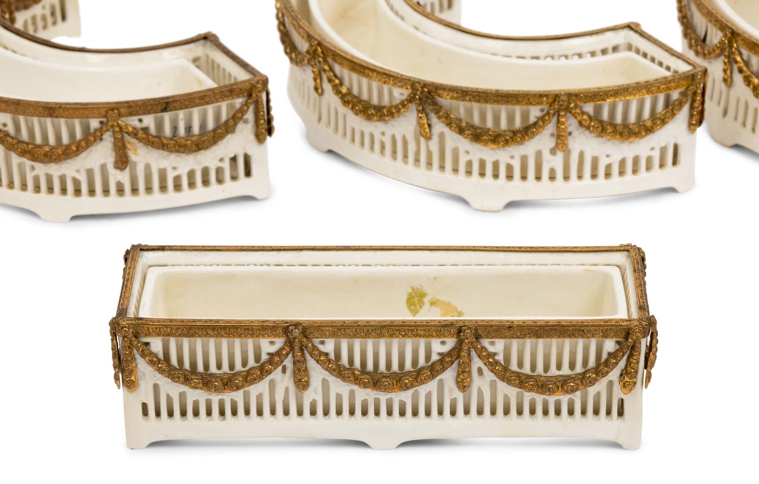 A Neoclassical Gilt Metal Mounted Ceramic Table Garniture