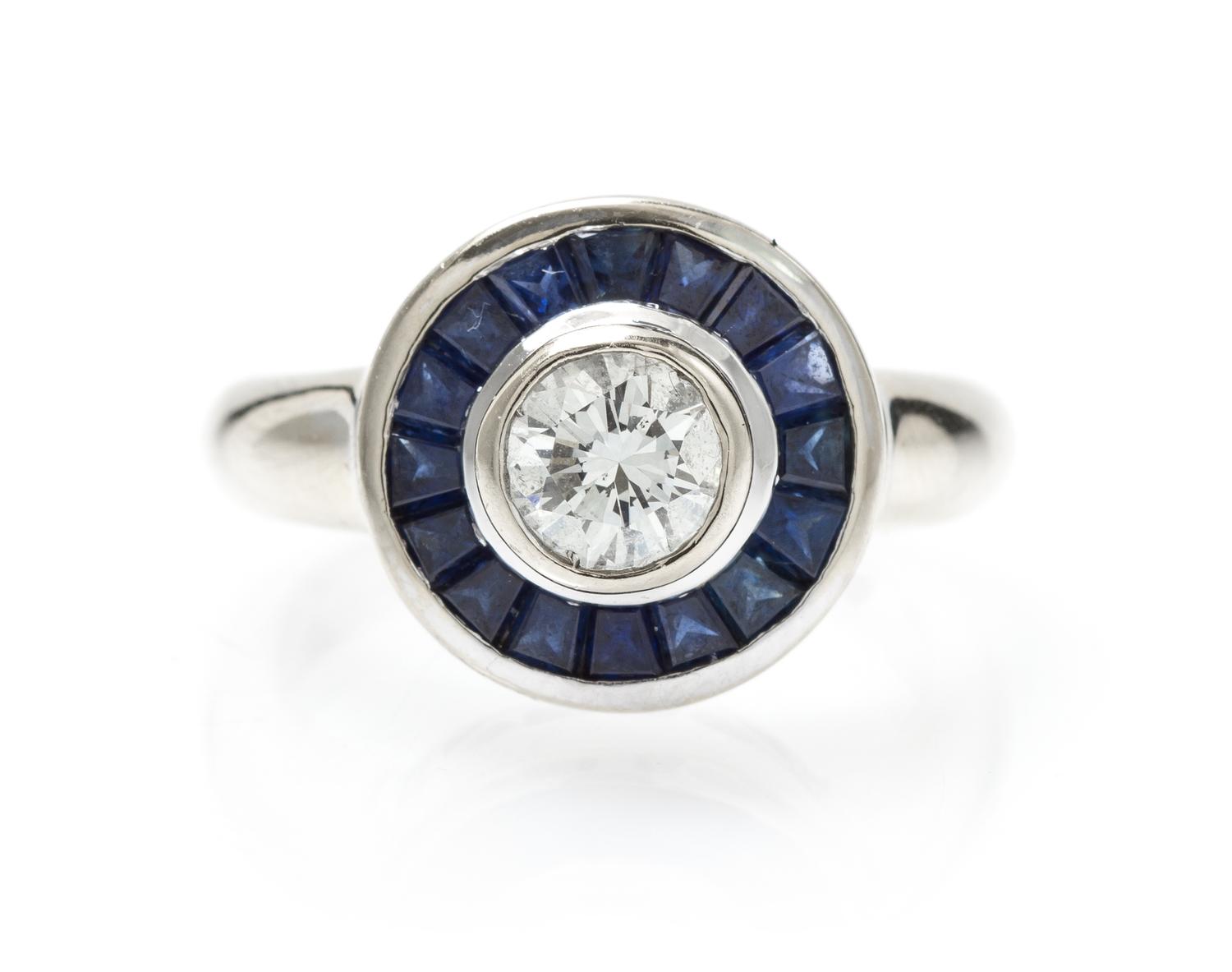 A White Gold, Diamond and Sapphire Ring, 6.40 dwts.