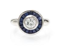 A White Gold, Diamond and Sapphire Ring, 6.40 dwts.