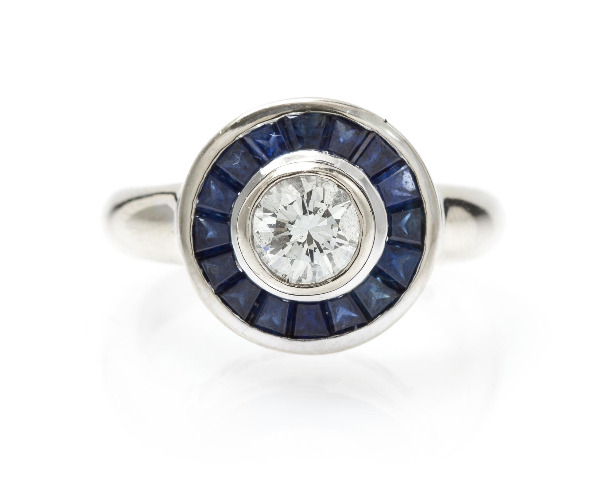 A White Gold, Diamond and Sapphire Ring, 6.40 dwts.