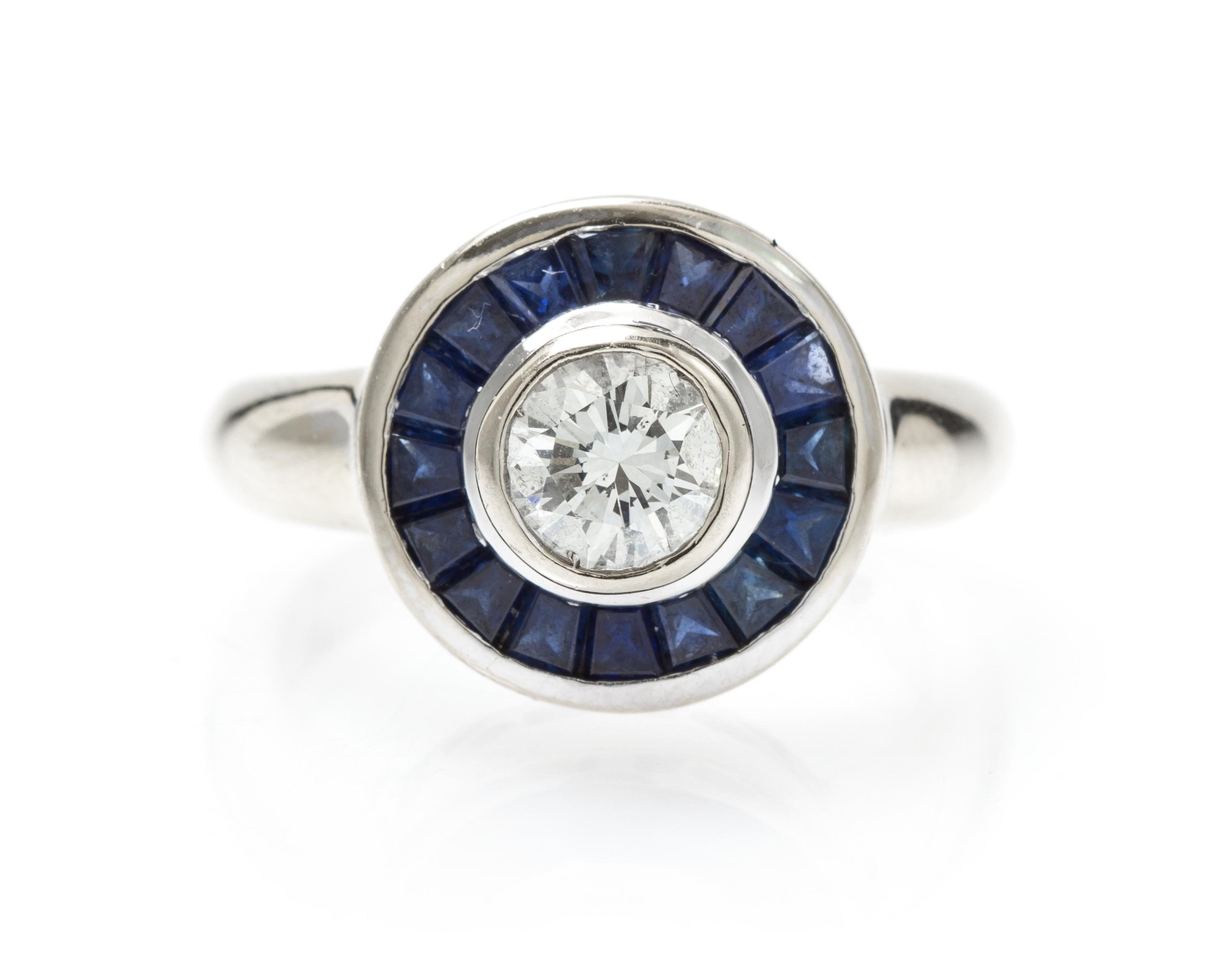 A White Gold, Diamond and Sapphire Ring, 6.40 dwts.