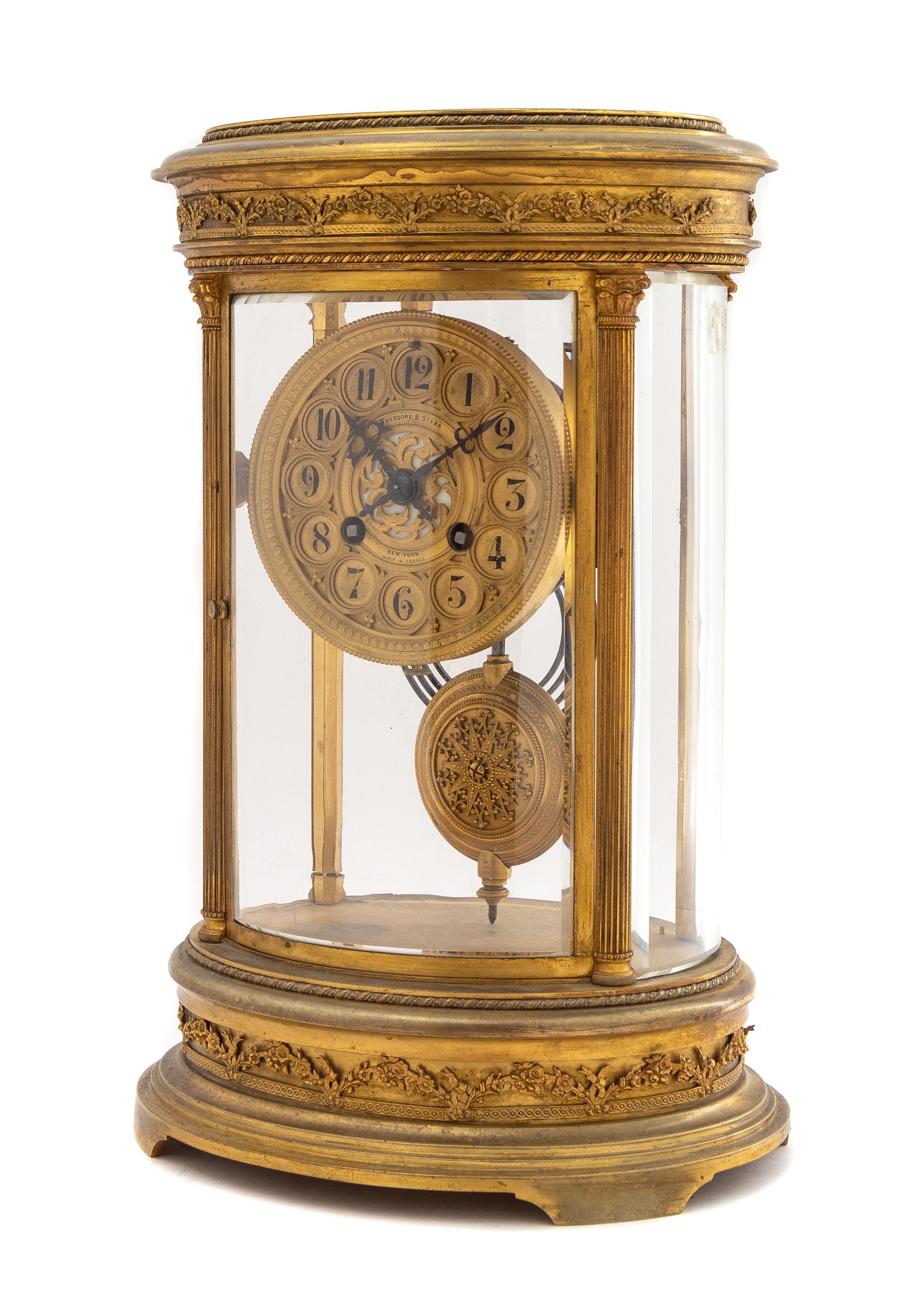 A French Gilt Bronze Mantel Clock Height 12 1/2 x width 8 1/2 inches. — MOVEMENT BY JAPY FRERES, RETAILED BY THEODORE B. STARR, NEW YORK, EARLY 20TH CENTURY