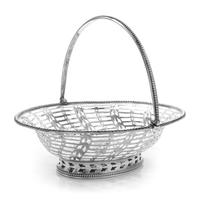 A George III Silver Reticulated Sweetmeat Basket, Hester Bateman, London, 1780, of oval form with a beaded edge and a swing handle, the