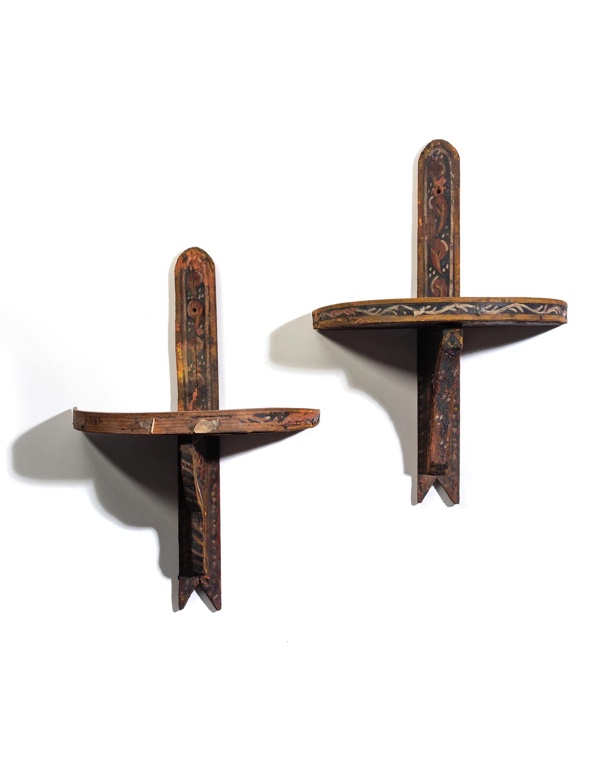 A Pair of Painted Wood Brackets