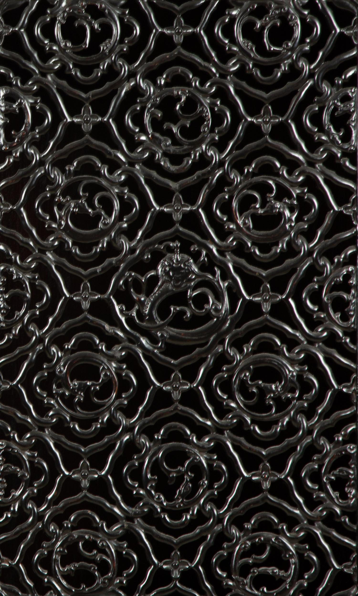 A Chinese Black Lacquer Cabinet with Pierce-carved Upper Door Panels