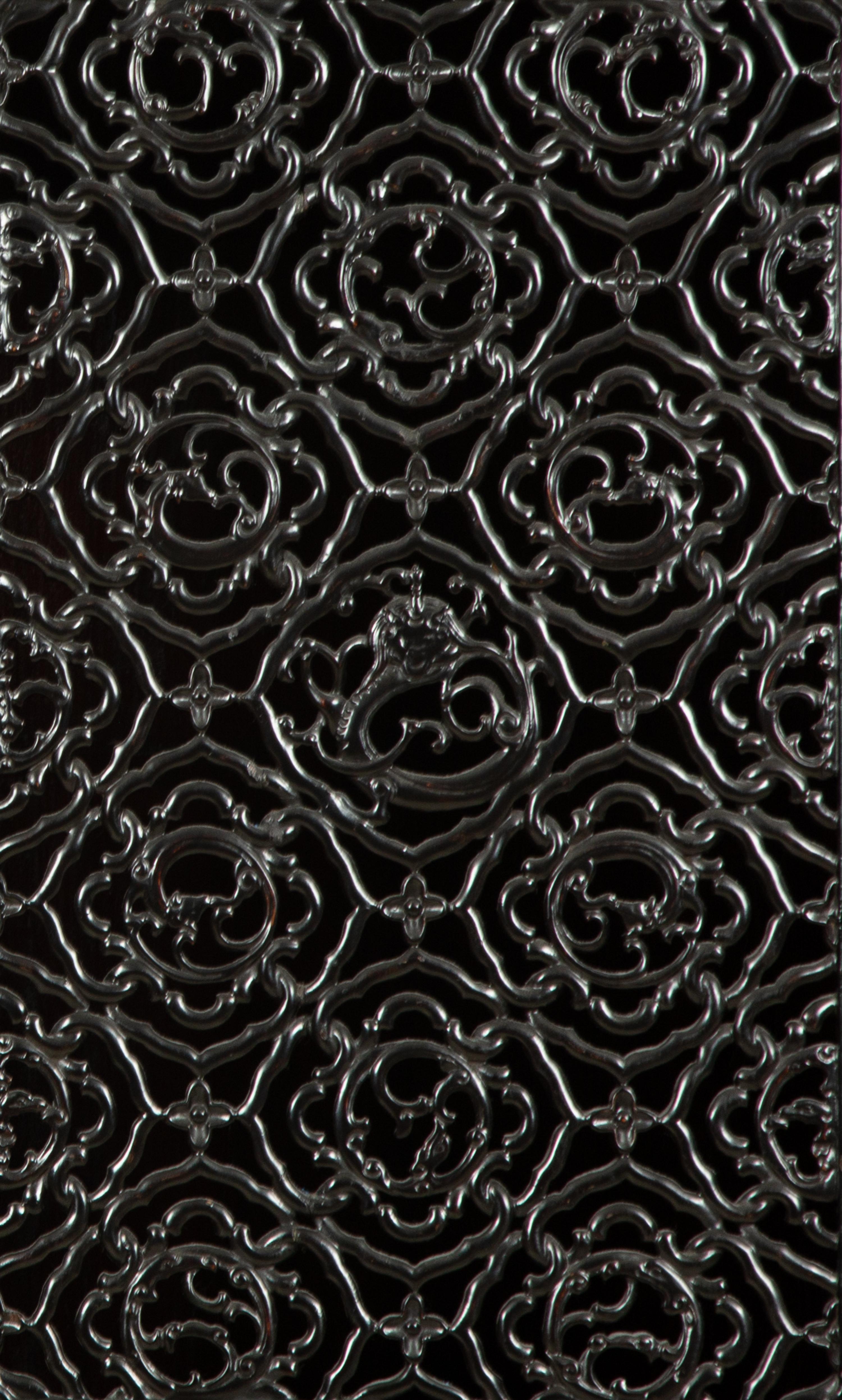 A Chinese Black Lacquer Cabinet with Pierce-carved Upper Door Panels