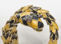 A Yellow Gold, Enamel, and Gemstone Snake Bracelet