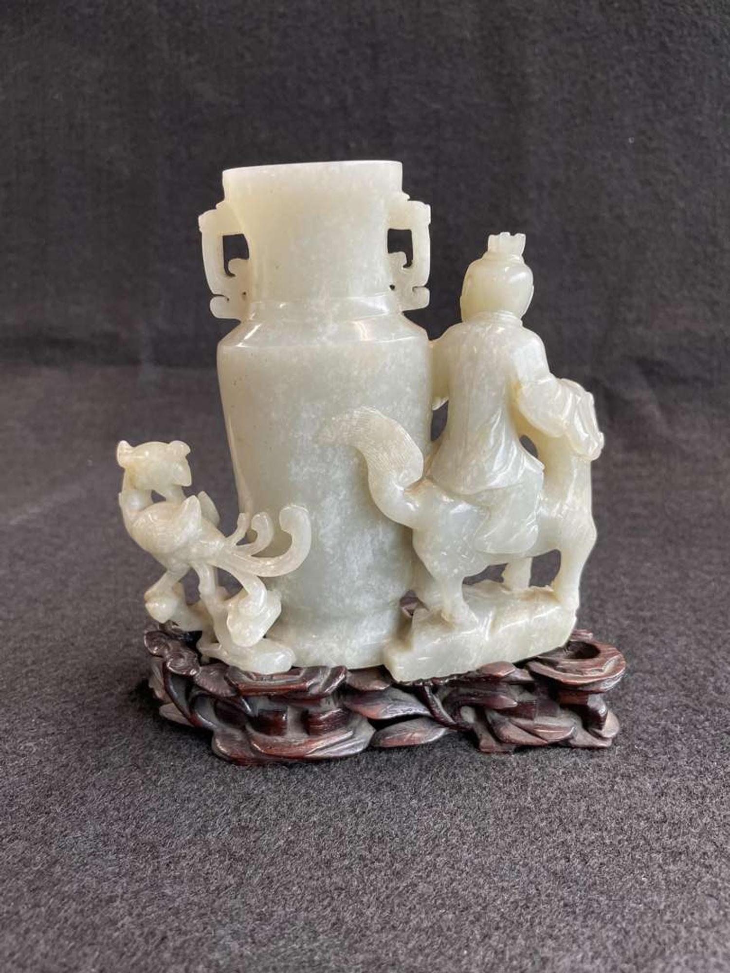 A Chinese jade "Boys, Kylin and Phoenix" vase on carved wood stand 玉雕童子凤鸟花樽及底座