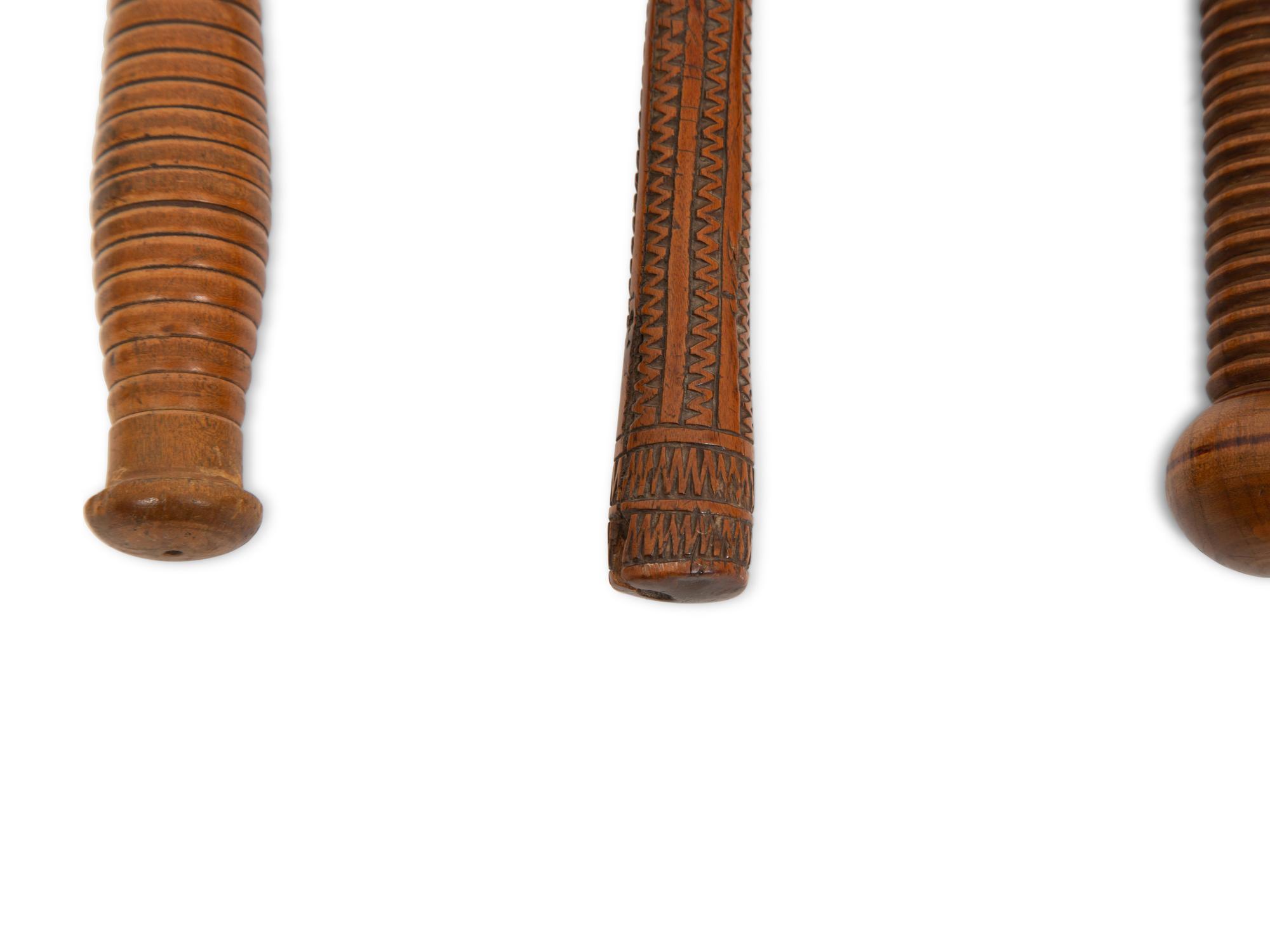 Three Carved Wood Clubs