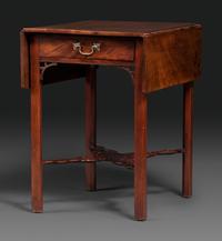 A Late Chippendale Carved and Figured Mahogany Stretcher-Base Pembroke Table