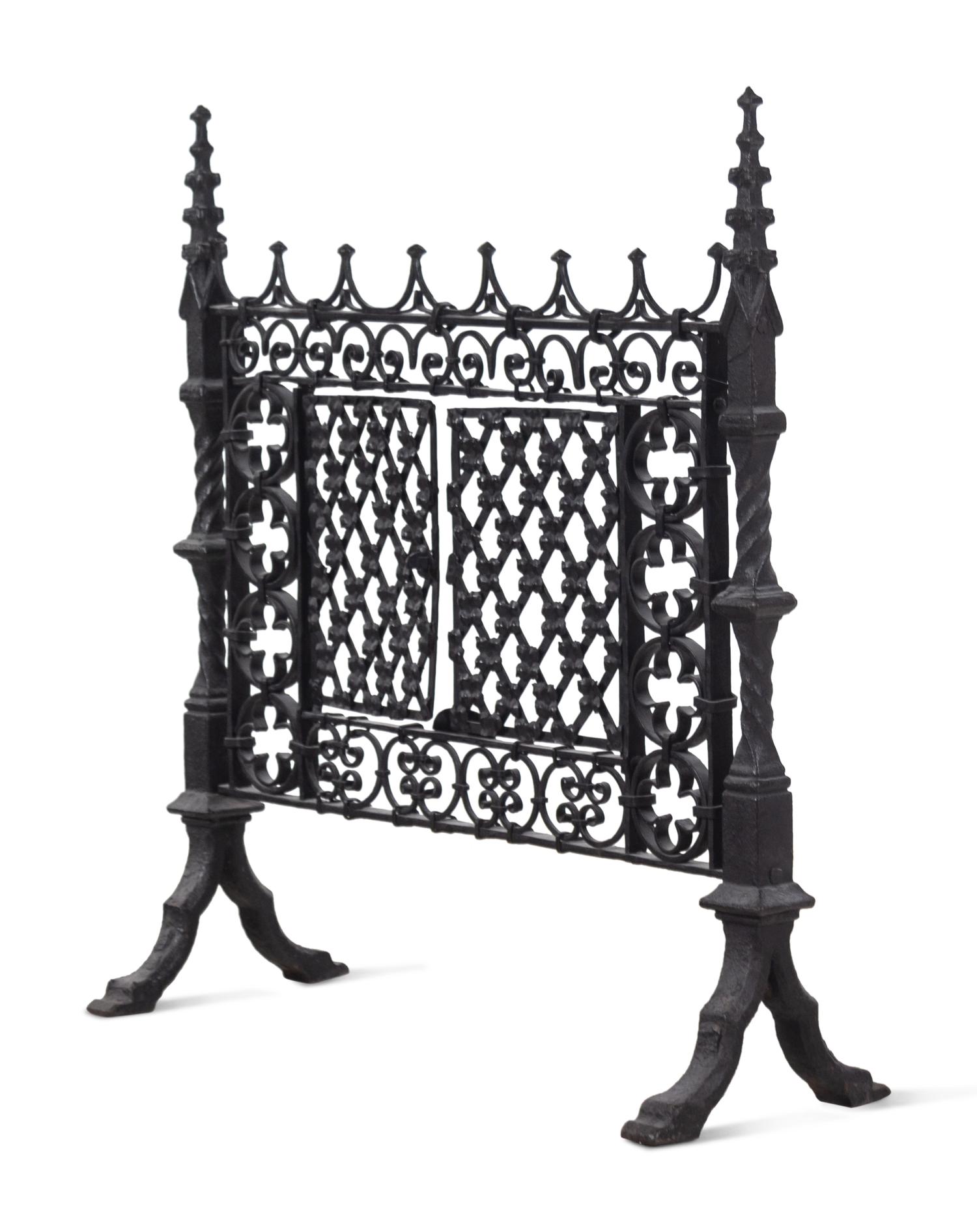 A Gothic Style Black Painted Wrought and Cast Iron Fire Screen