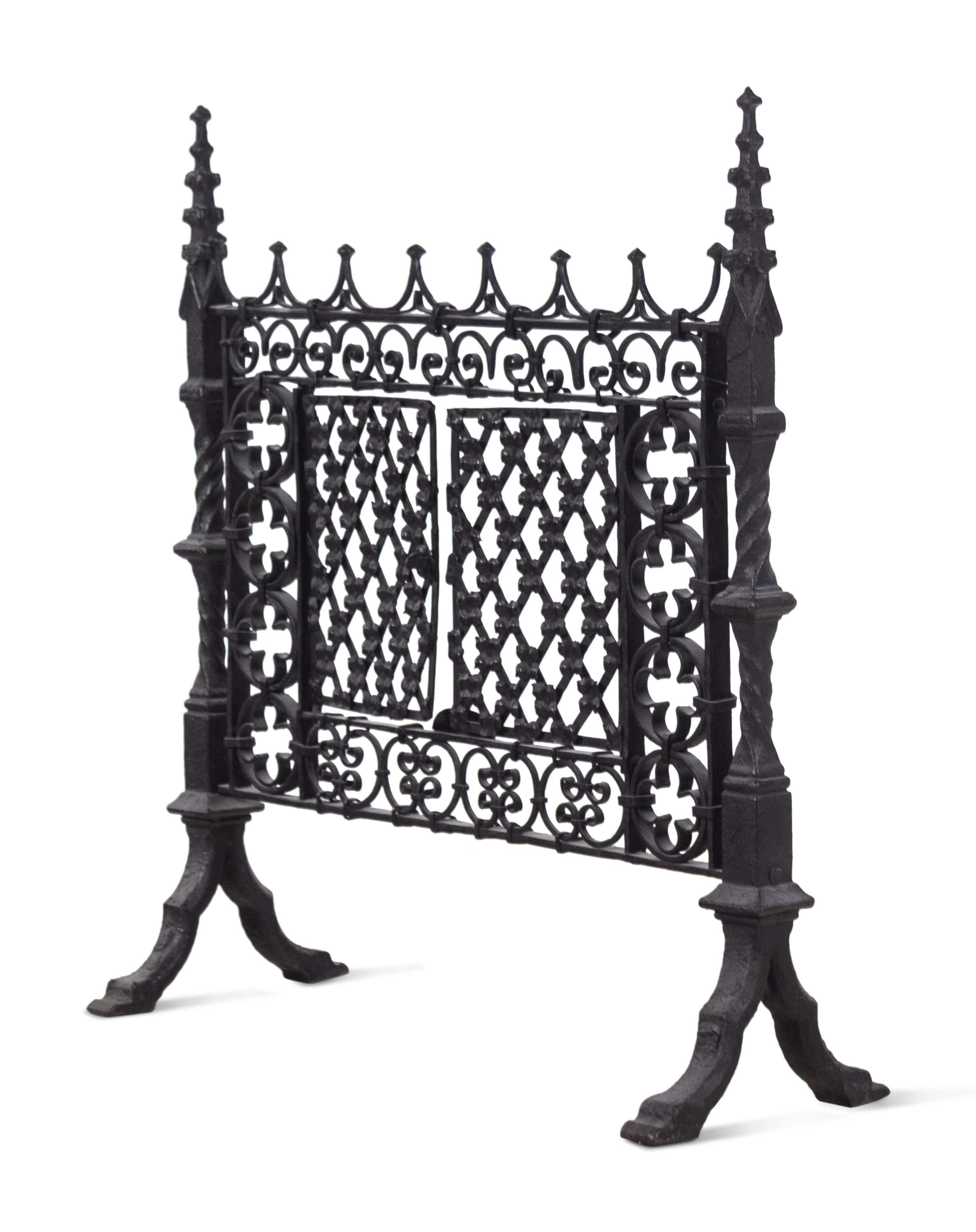 A Gothic Style Black Painted Wrought and Cast Iron Fire Screen