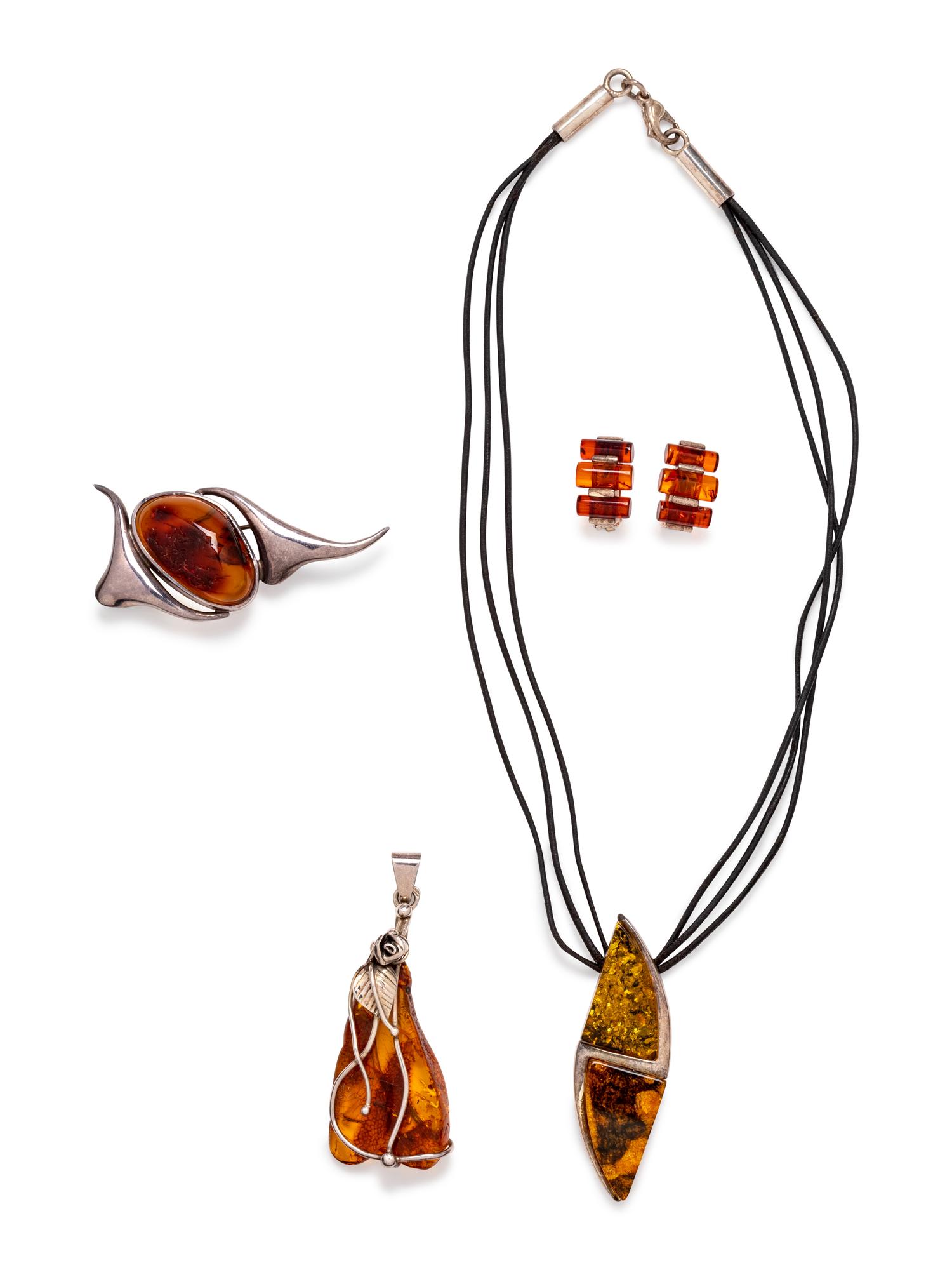 (Do not recommend re-offering) A Collection of Sterling Silver and Amber Jewelry,
