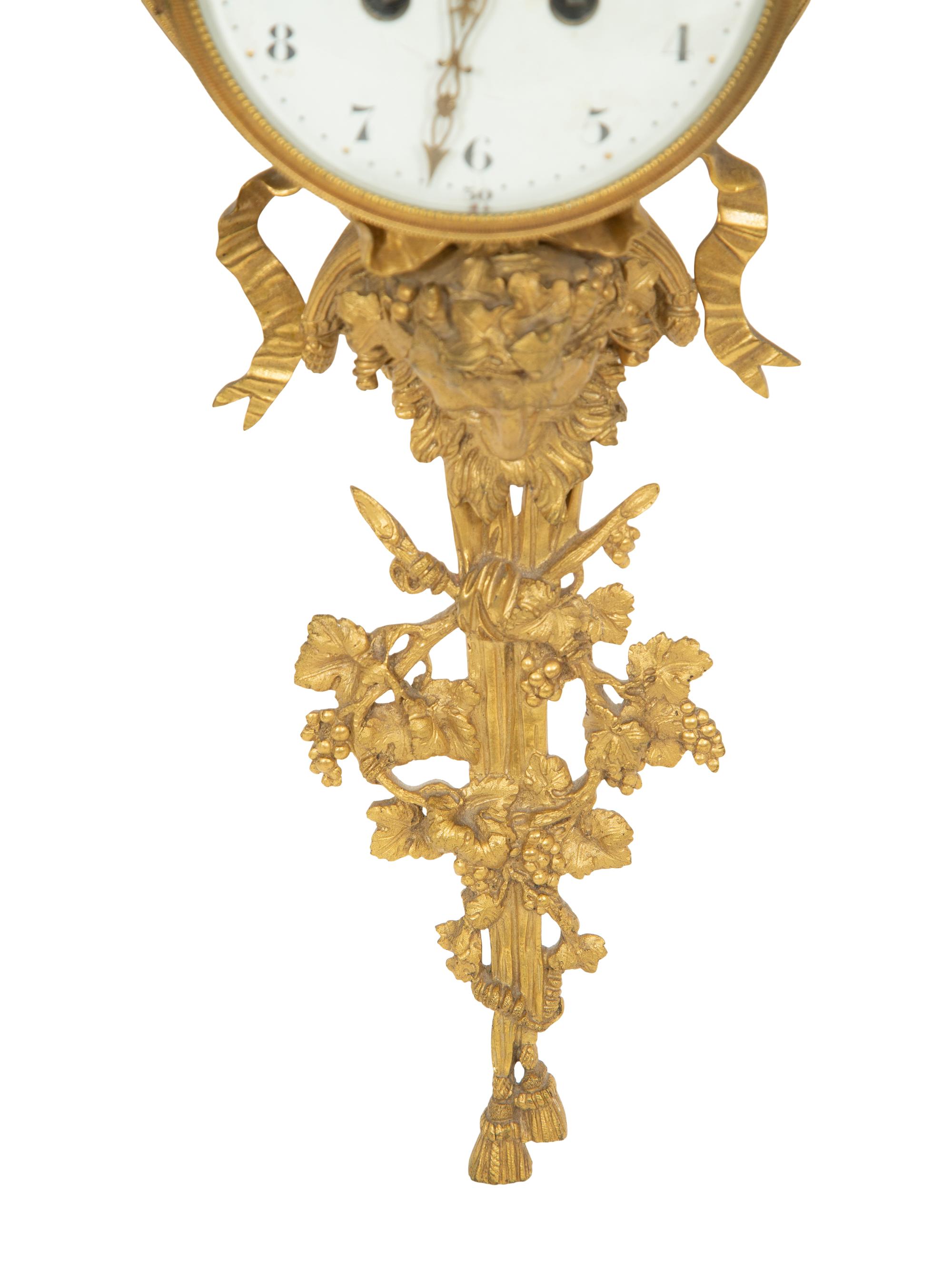 A Louis XVI Style Gilt Bronze Cartel Clock