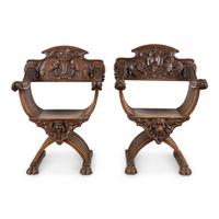 A Pair of Italian Carved Walnut Savonarola Chairs