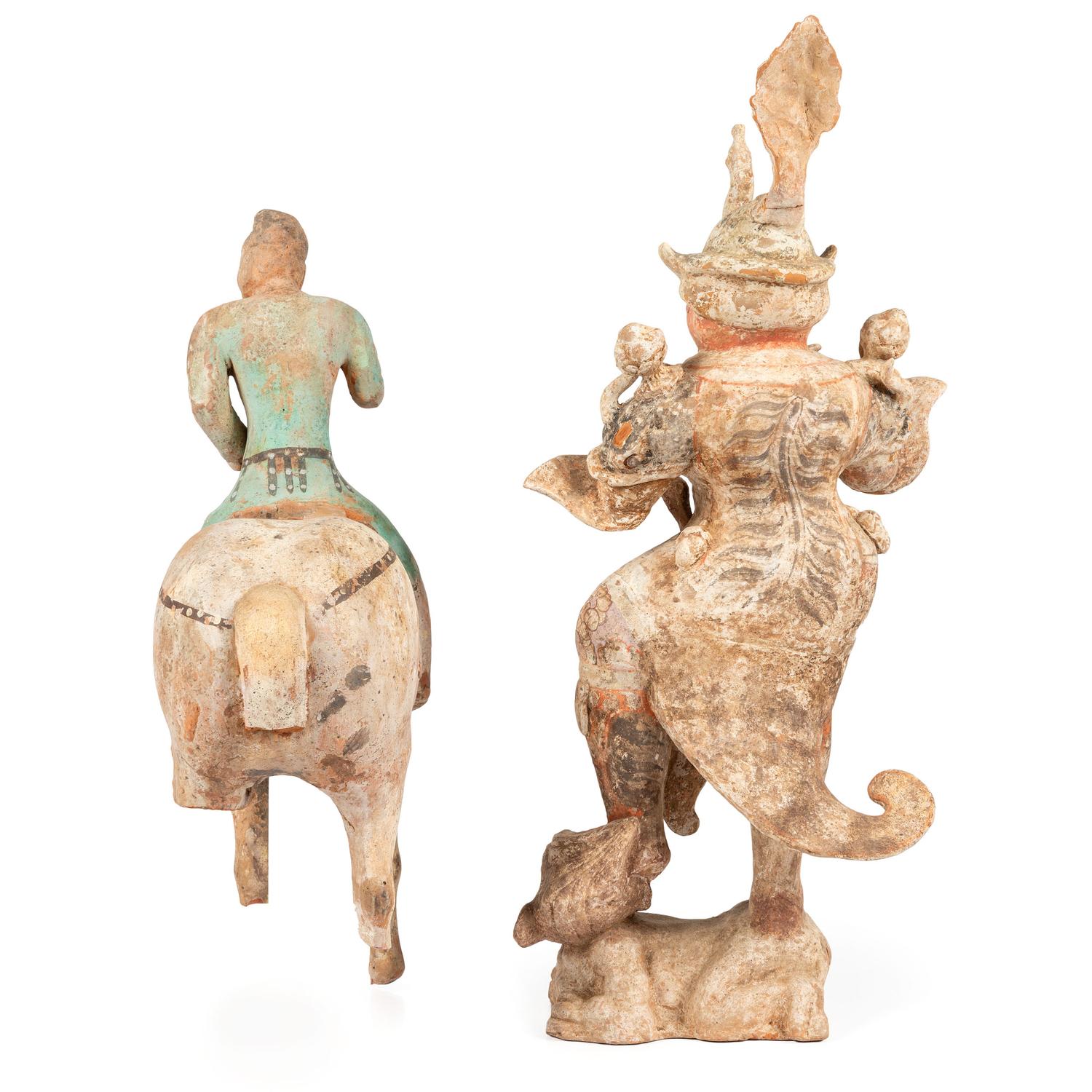 A Chinese Terracotta Equestrian Figure and a Standing Warrior with Lion