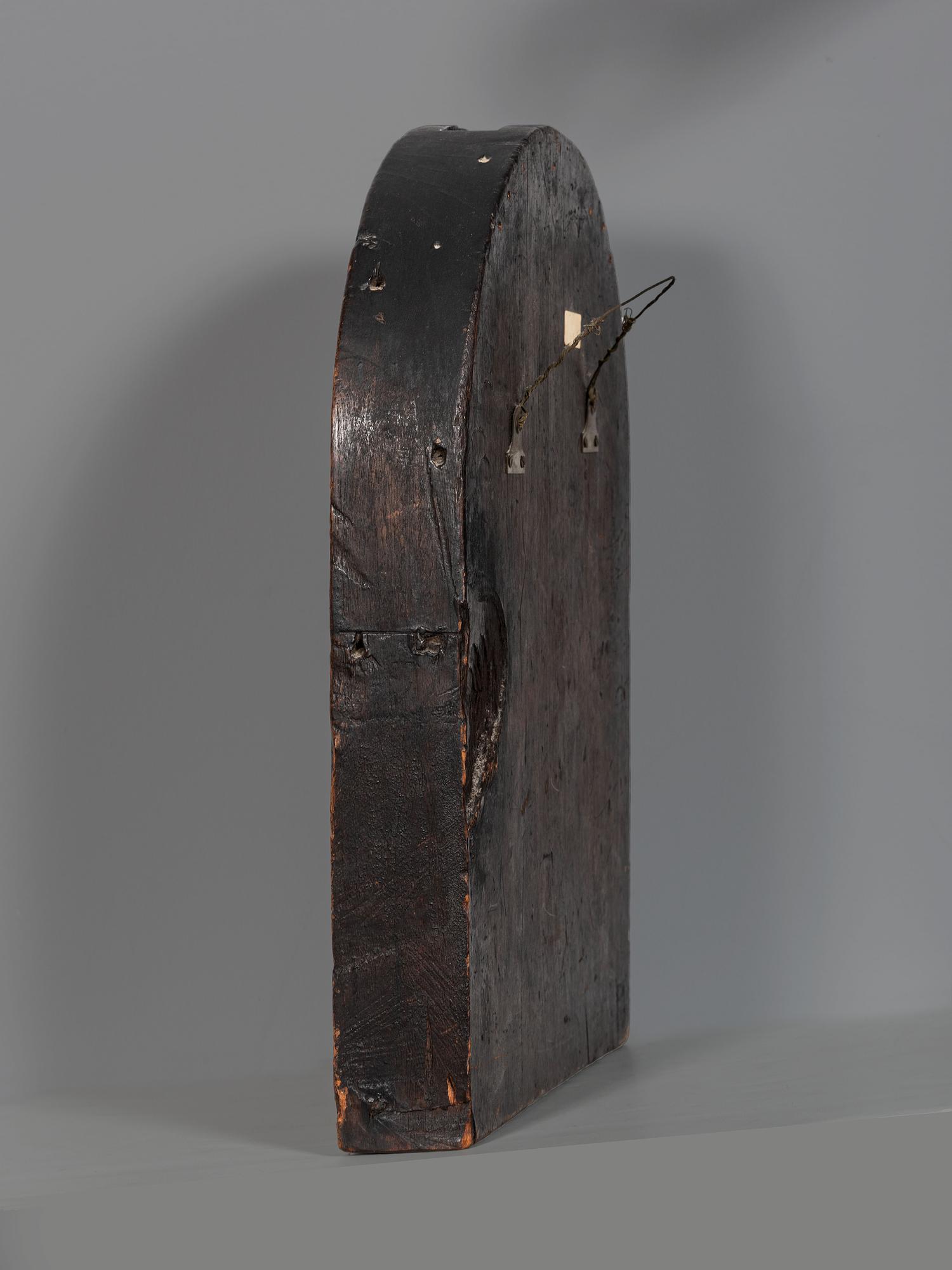 A Carved Walnut Ship Board Panel of a Sailor