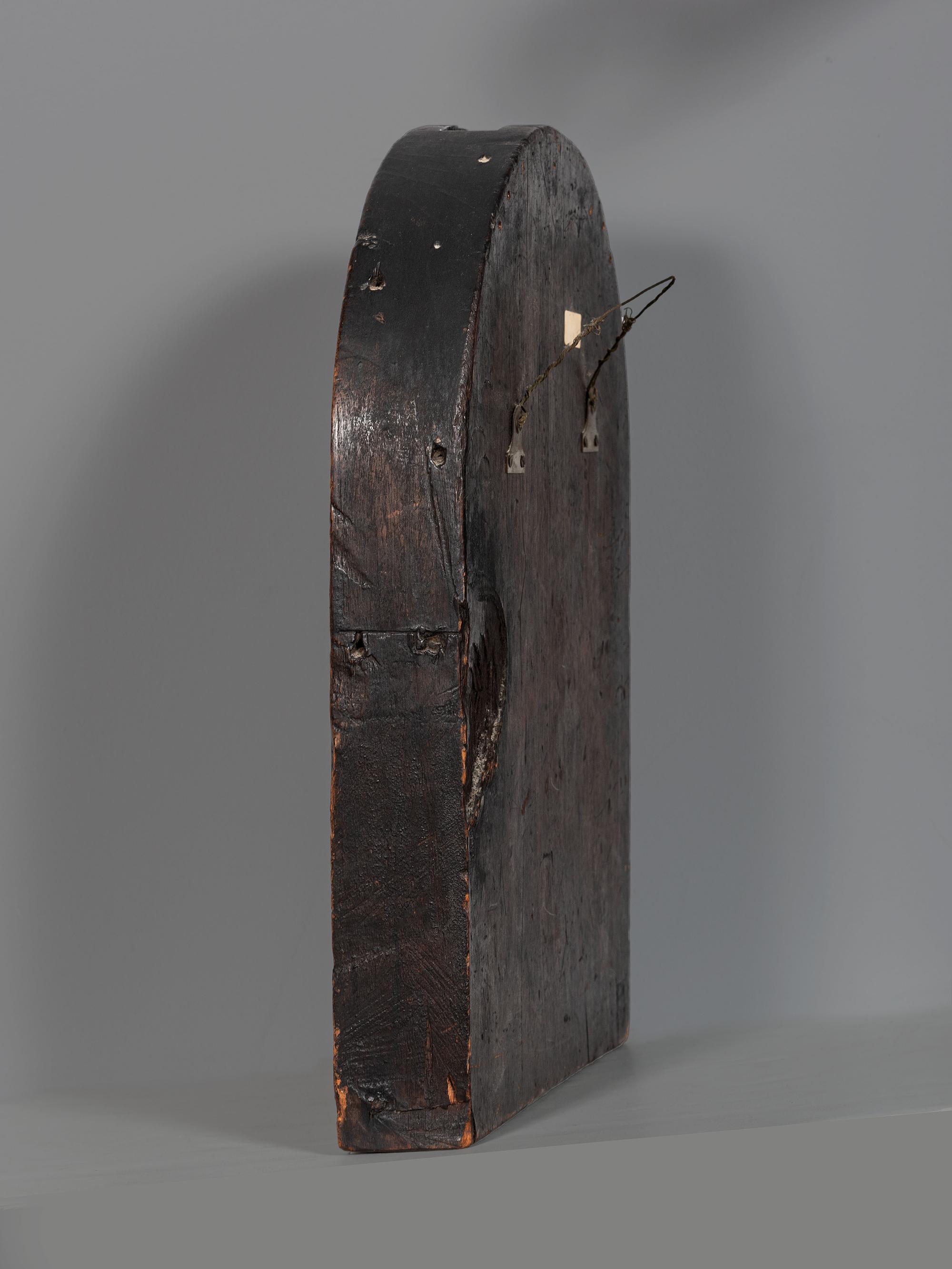 A Carved Walnut Ship Board Panel of a Sailor