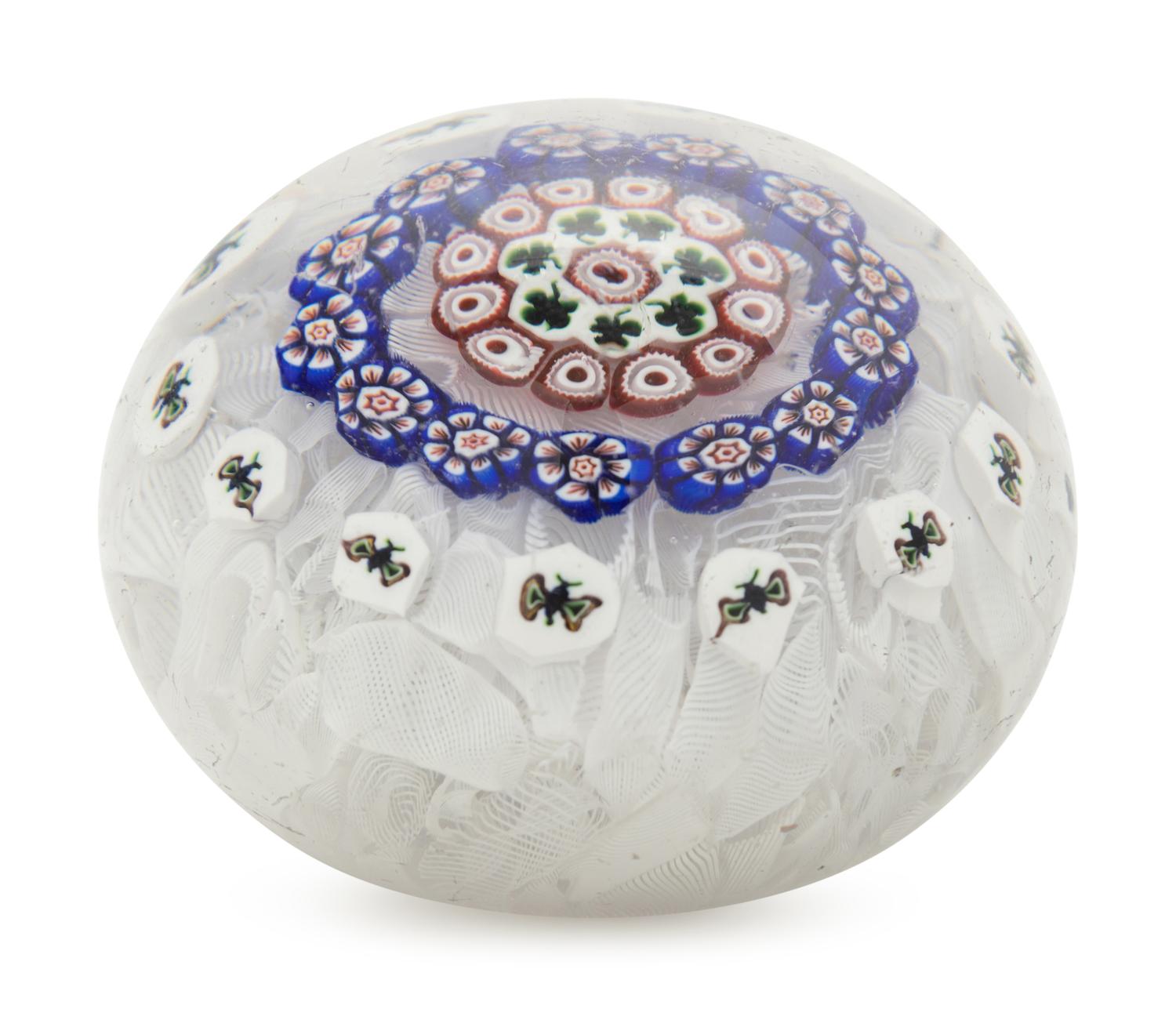 A Baccarat Concentric Patterned Shamrock and Butterfly Millefiori on Upset Muslin Glass Paperweight