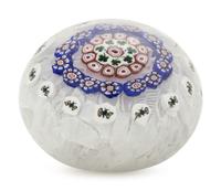 A Baccarat Concentric Patterned Shamrock and Butterfly Millefiori on Upset Muslin Glass Paperweight