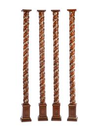 A Set of Four Carved and Silvered Solomonic Columns