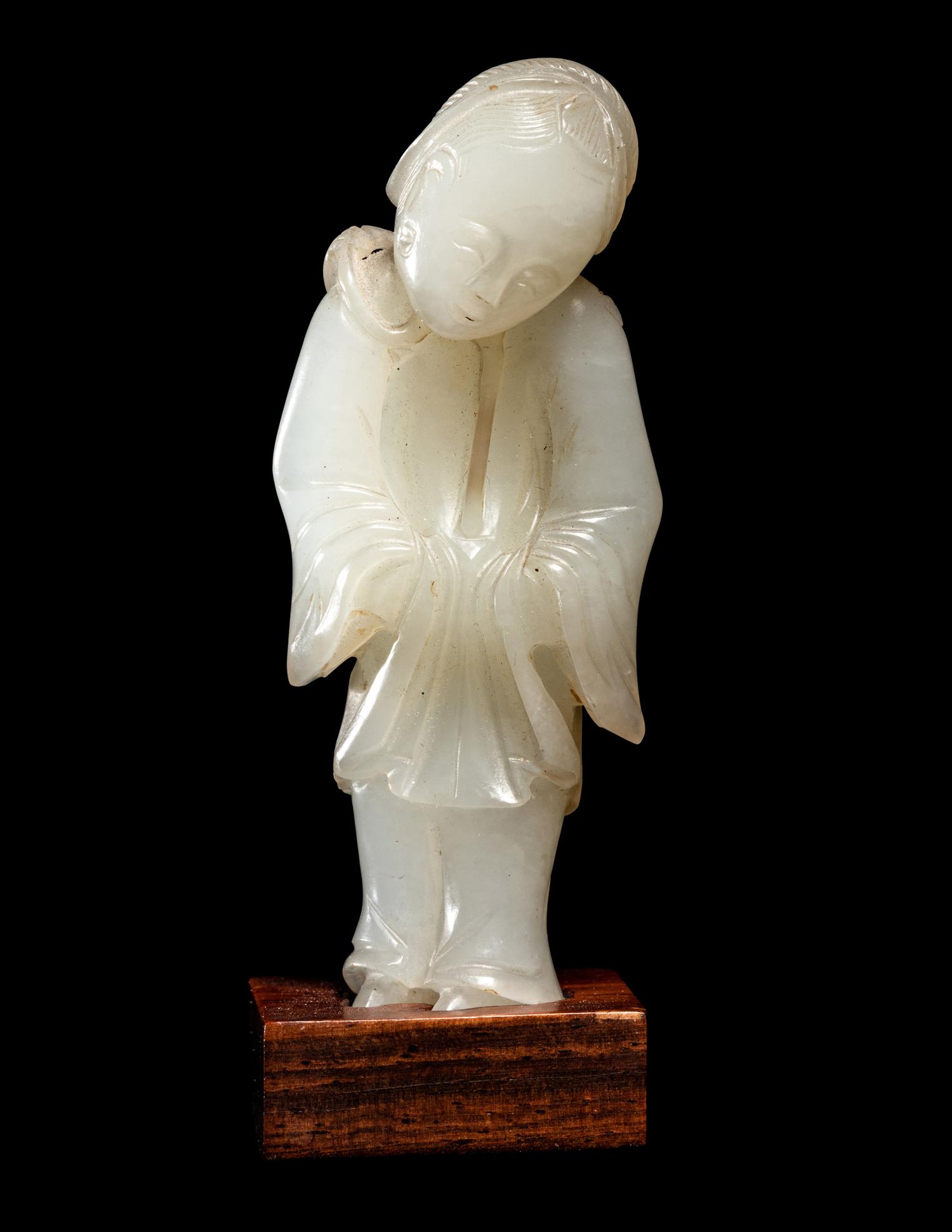 Two Carved Pale Celadon Jade Figures