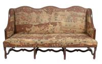A Victorian Tapestry Upholstered Wing-Back Settee Height 40 x width 77 x depth 34 inches.