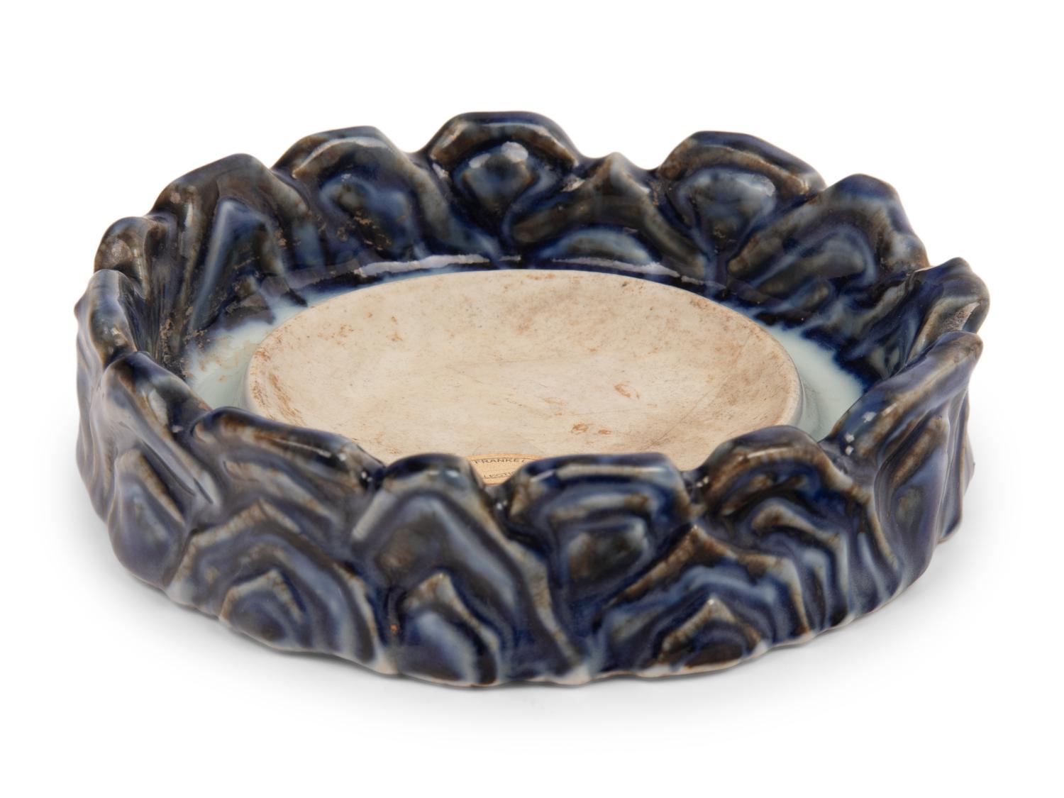 A Underglaze Red and Blue Porcelain 'Wave'-Form Inkstone