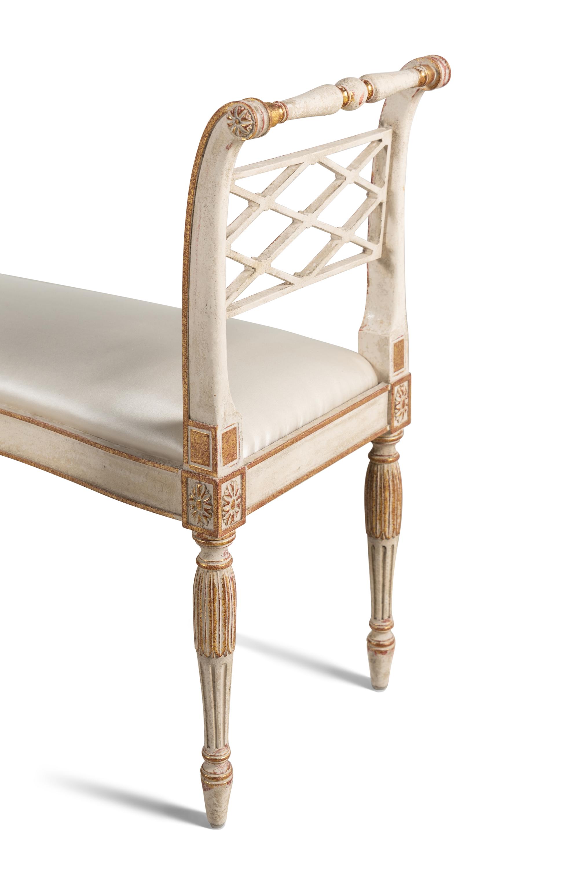 A Pair of George III Style Painted and Parcel-Gilt Window Benches