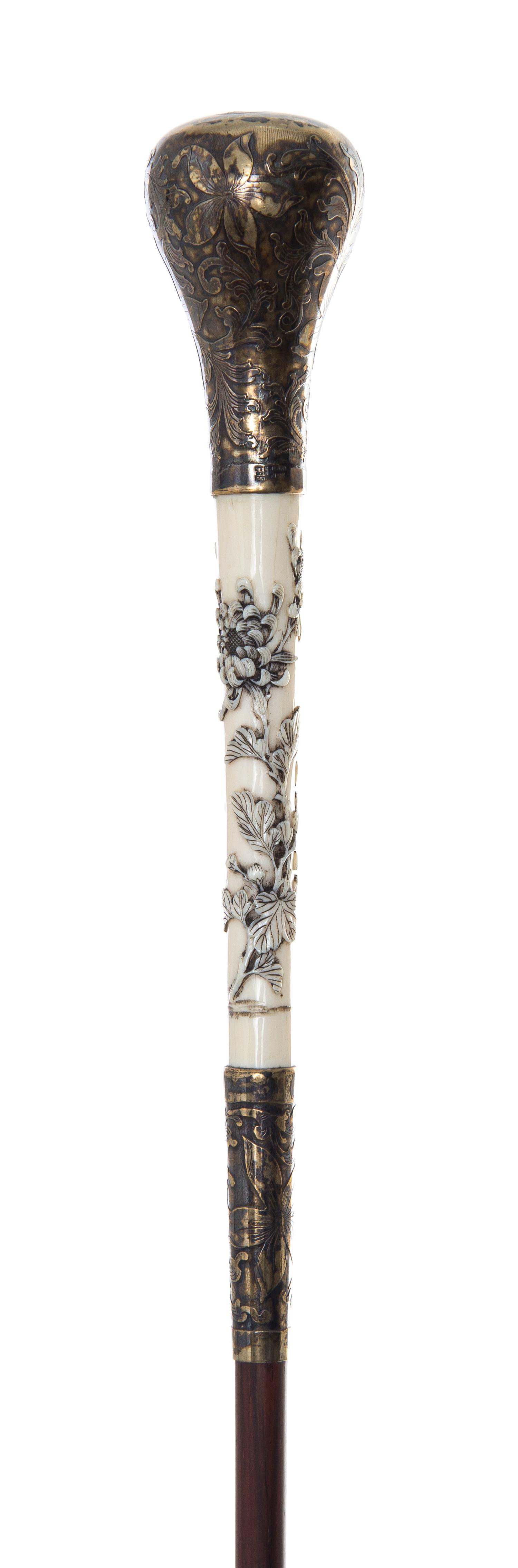 An American Silver and Japanese Ivory Handled Lady's Walking Stick, Length of handle 2 3/4 x length overall 35 1/2 inches.