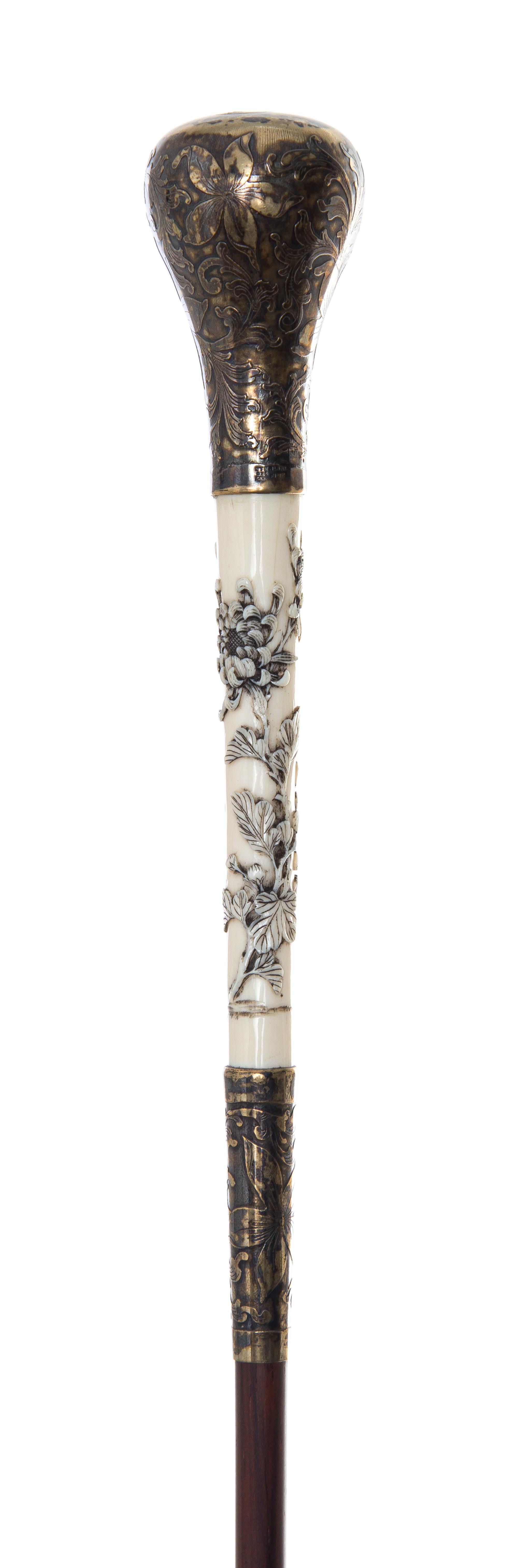 An American Silver and Japanese Ivory Handled Lady's Walking Stick, Length of handle 2 3/4 x length overall 35 1/2 inches.
