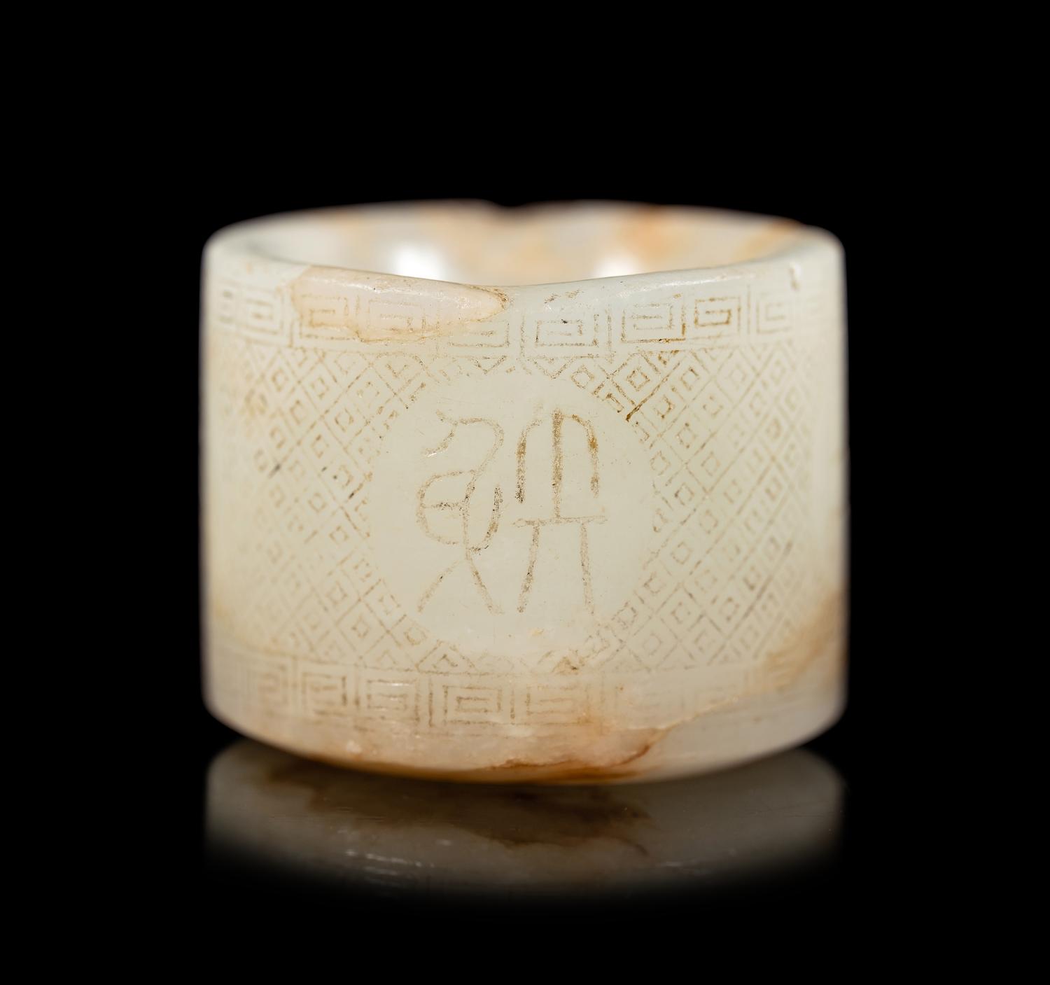 An Incised White Jade Archer's Ring