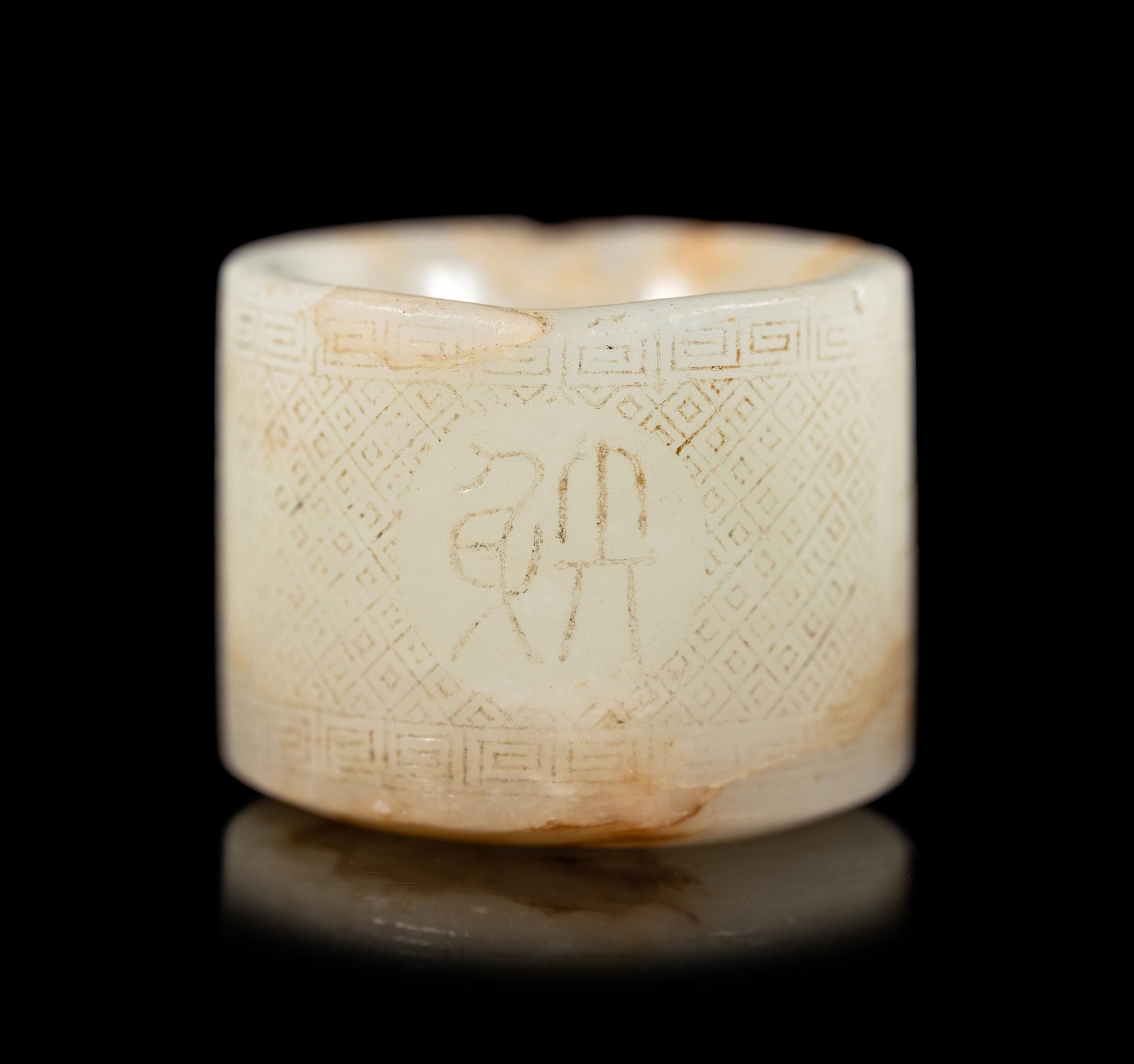 An Incised White Jade Archer's Ring