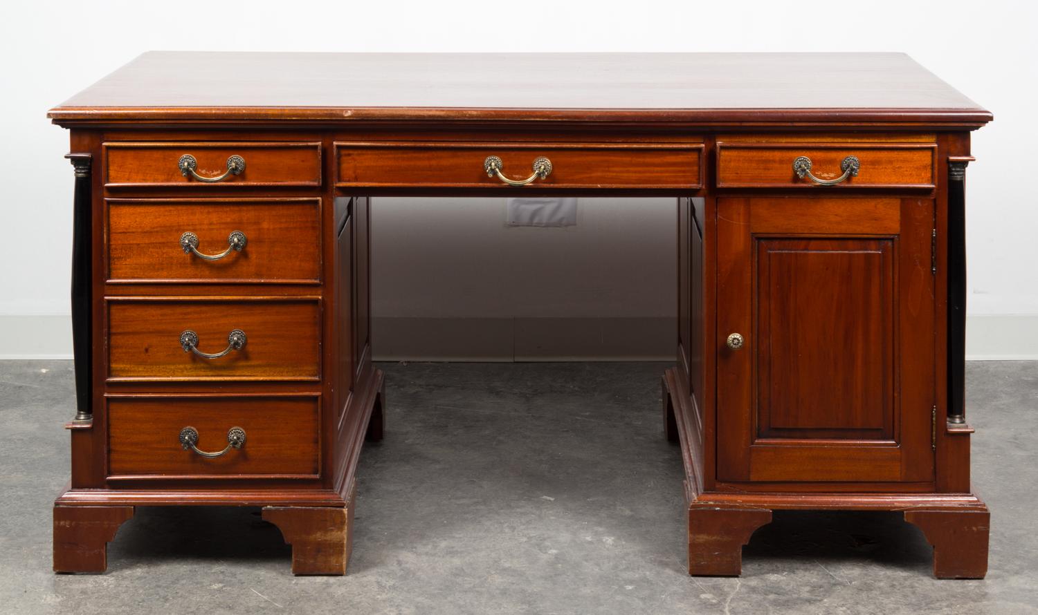 An Empire Style Mahogany Pedestal Desk Height 29 5/8 x width 60 x depth 29 3/8 inches. — 20TH CENTURY