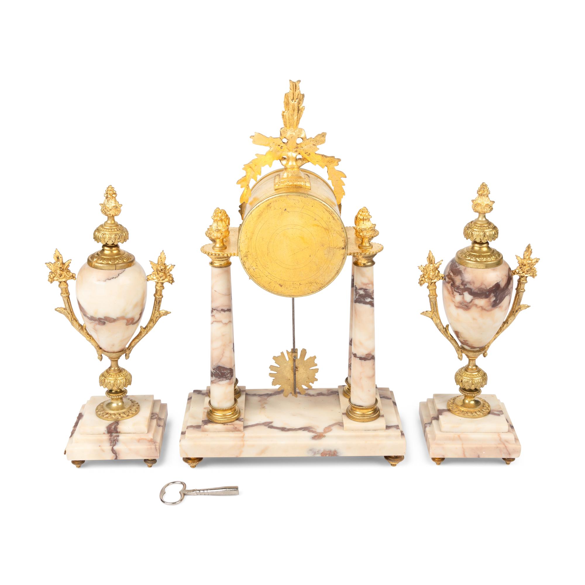 A French Gilt Bronze Mounted Marble Clock Garniture