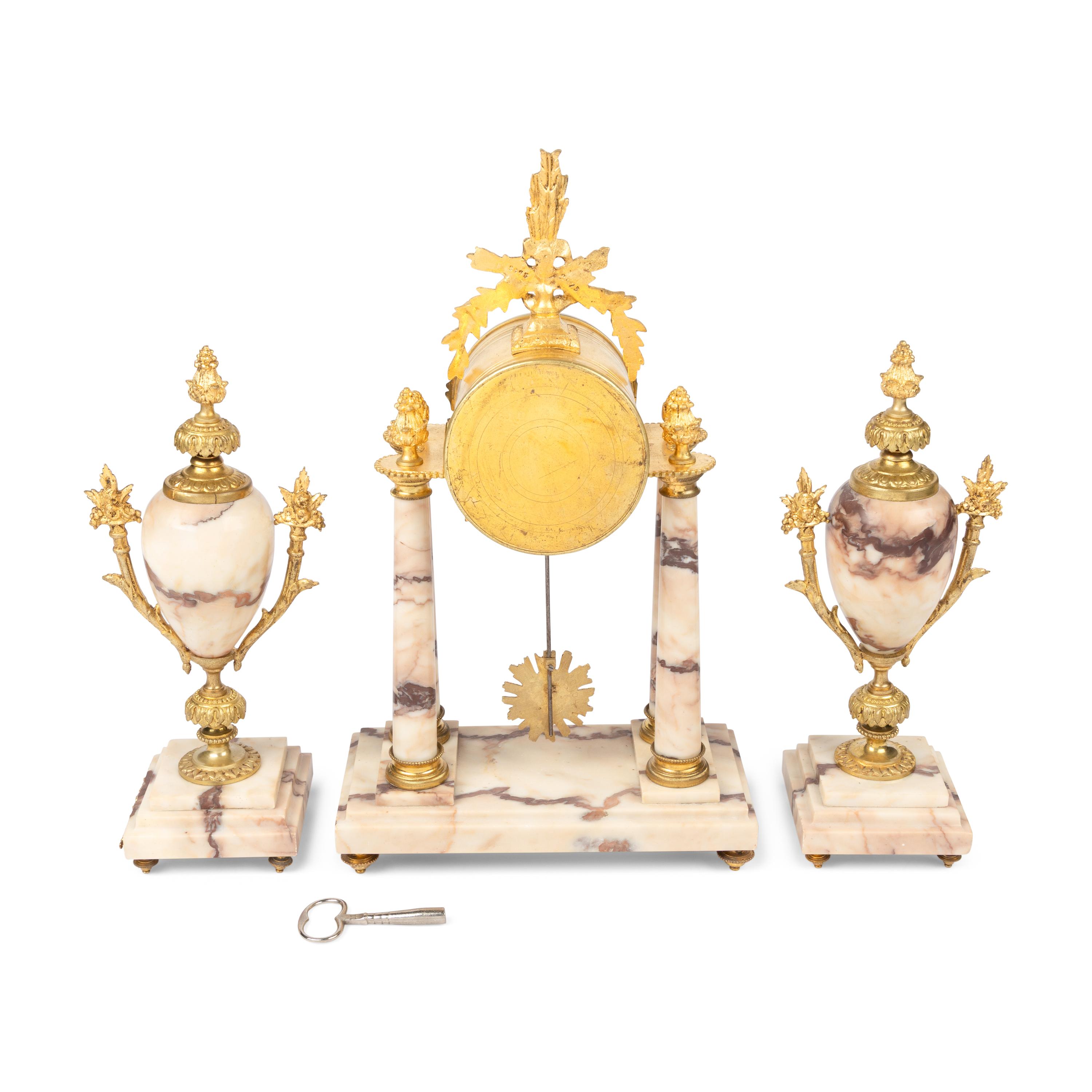 A French Gilt Bronze Mounted Marble Clock Garniture