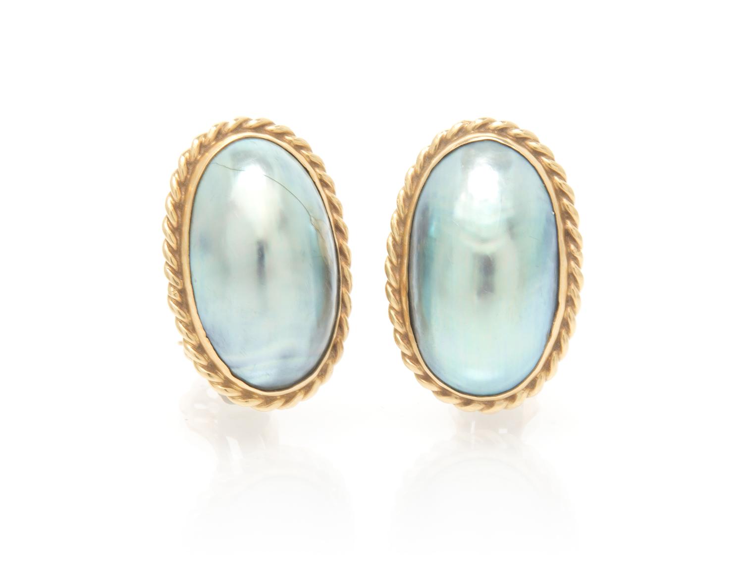 A Pair of Yellow Gold and Cultured Mabe Pearl Earclips, 10.30 dwts.