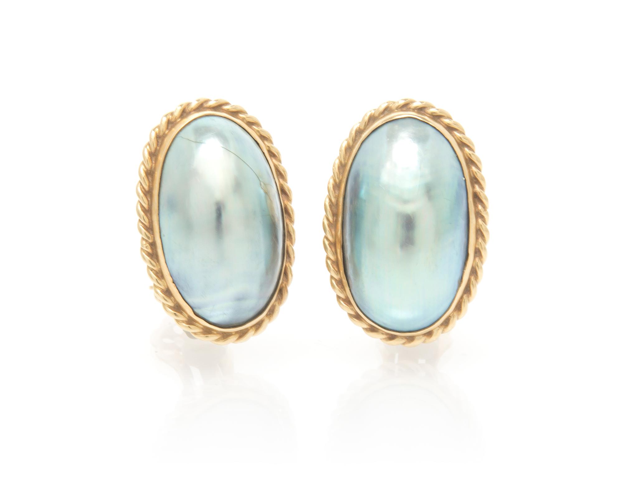 A Pair of Yellow Gold and Cultured Mabe Pearl Earclips, 10.30 dwts.