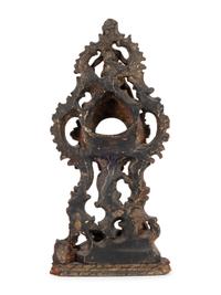 A Continental Rococo Style Carved Fruitwood Watch Stand