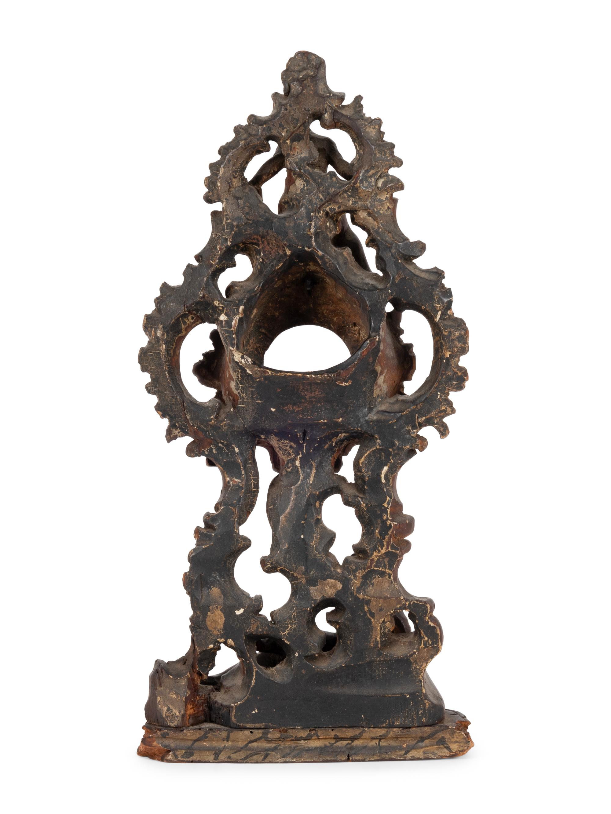 A Continental Rococo Style Carved Fruitwood Watch Stand