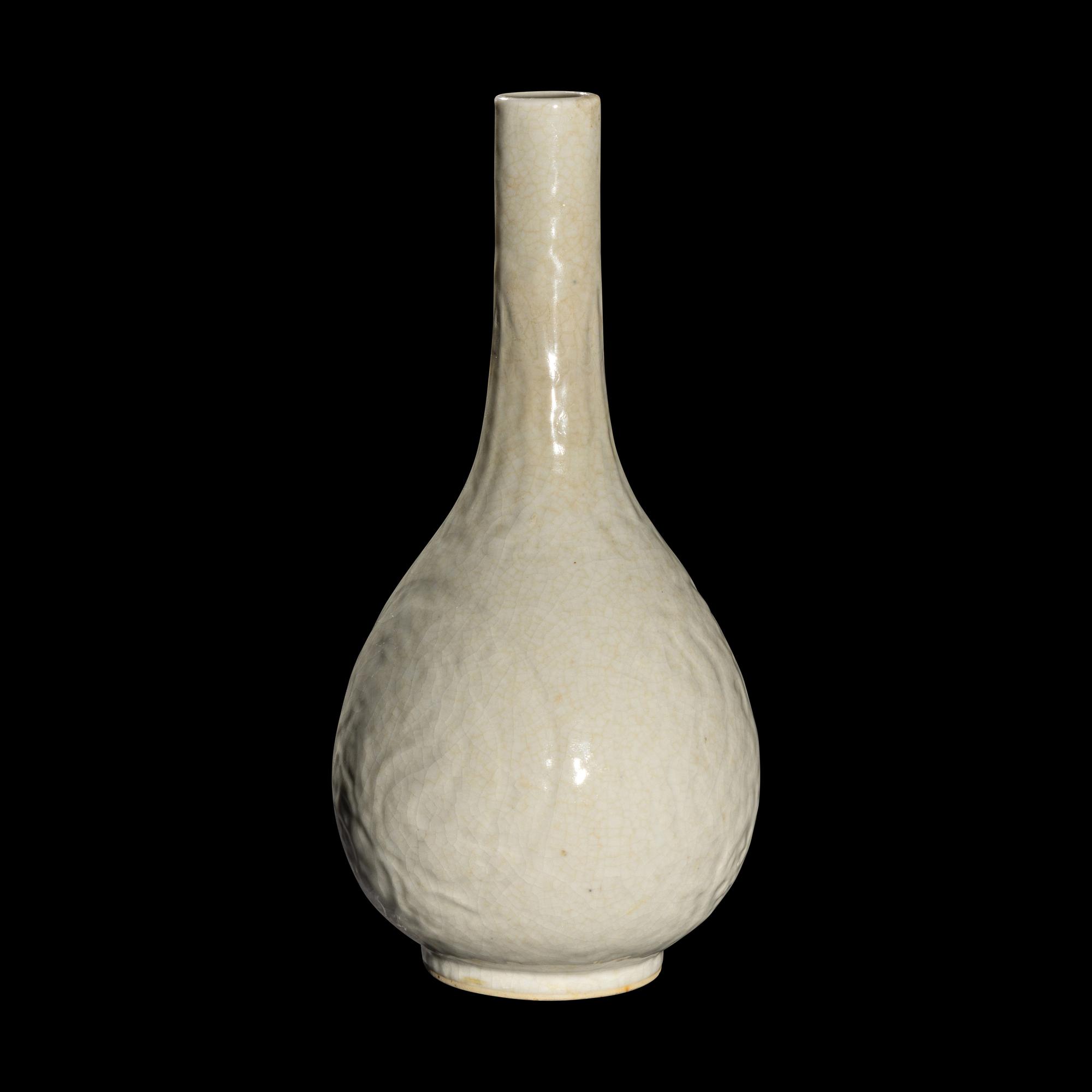 A Chinese Molded White Glazed Porcelain Bottle Vase, 18th/19th Century 清中期 白釉模印如意纹膽瓶