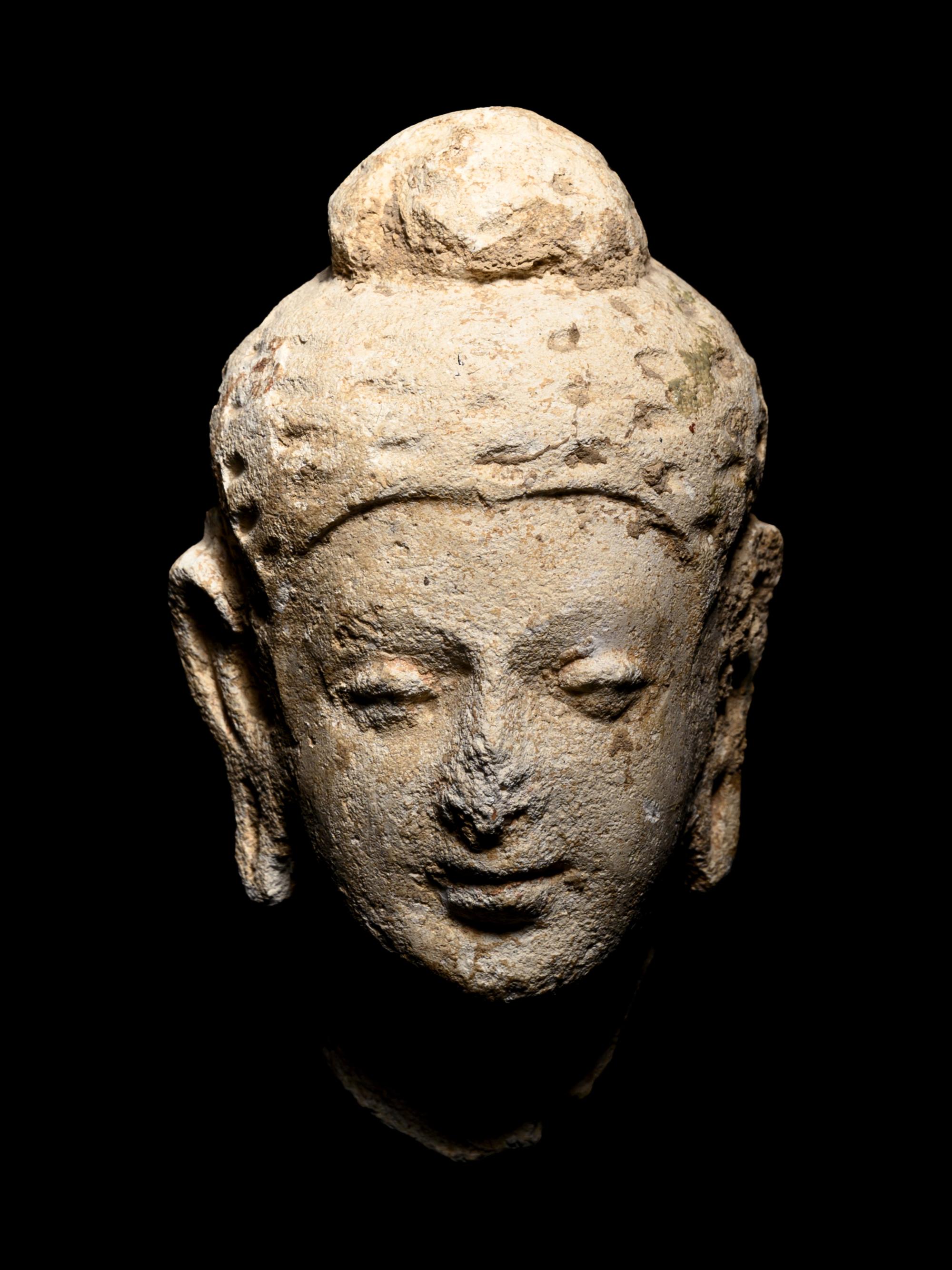 Four Gandharan Fragmentary Stucco Heads and One Bust