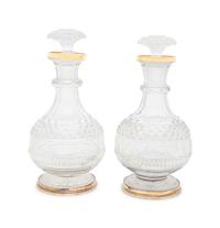 A Near Pair of George III Silver-Gilt Mounted Cut Glass Decanters