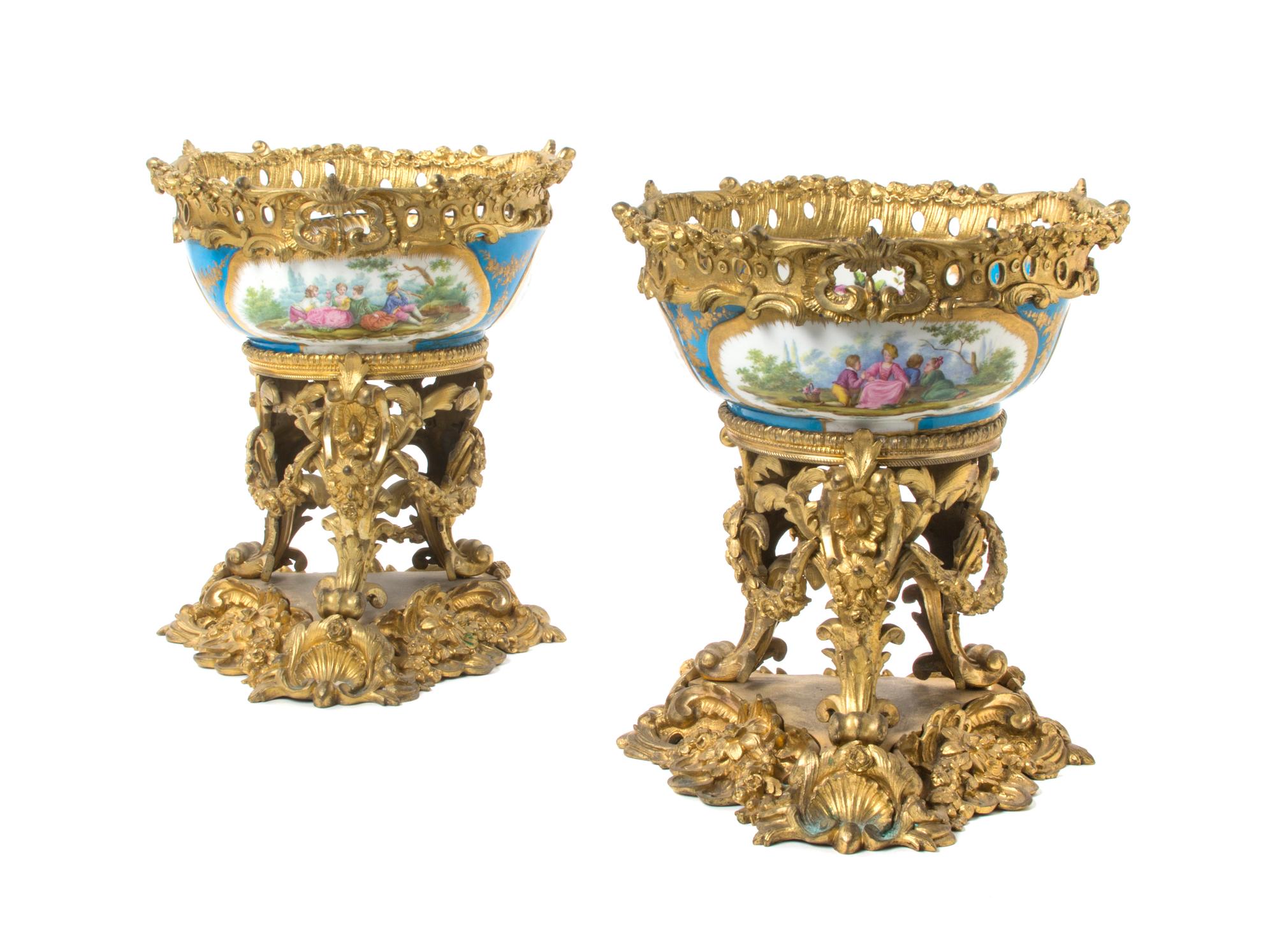 A Pair of Sevres Style Porcelain and Gilt Bronze Mounted Center Bowls, Height 12 1/2 inches.