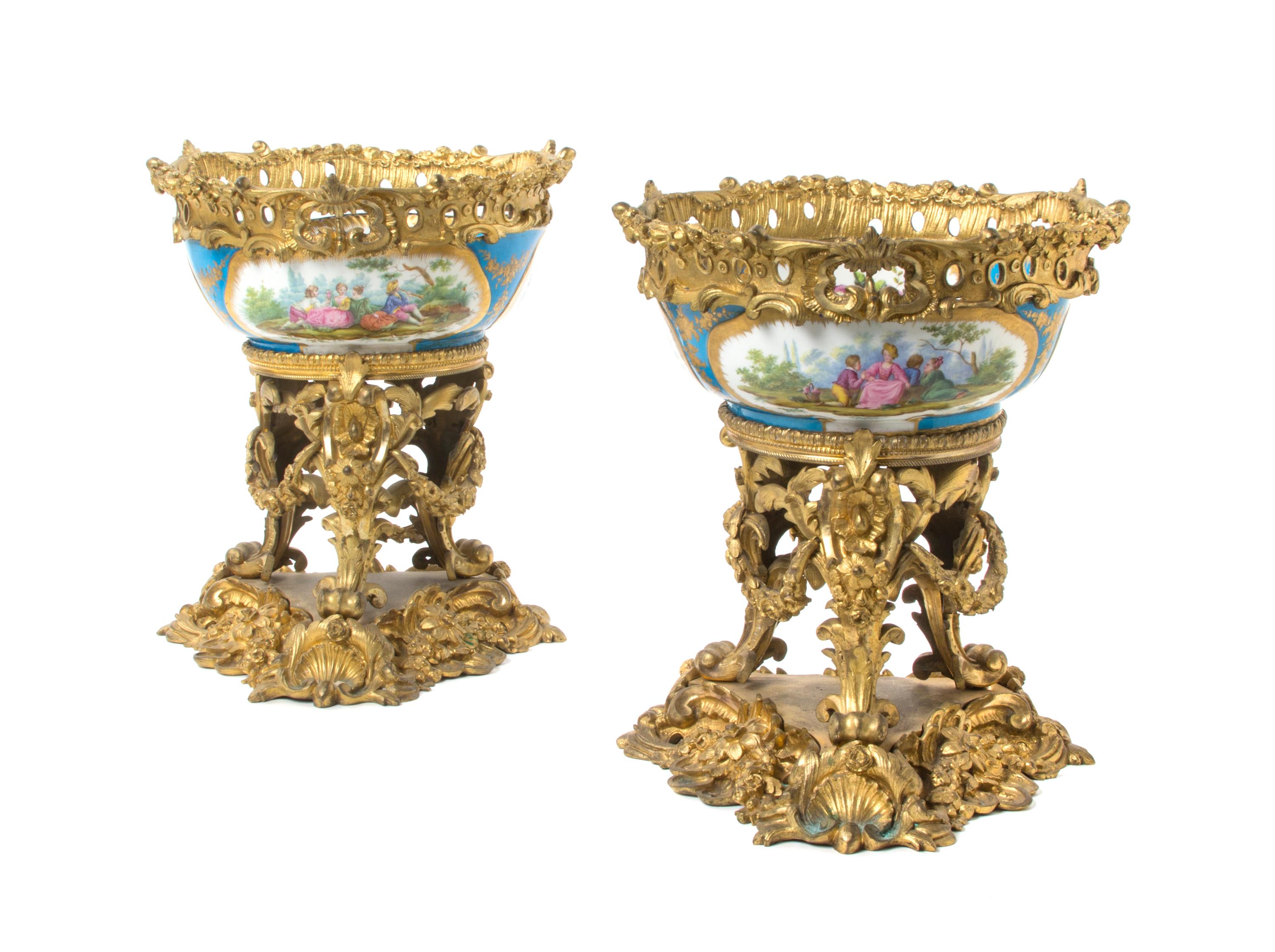 A Pair of Sevres Style Porcelain and Gilt Bronze Mounted Center Bowls, Height 12 1/2 inches.