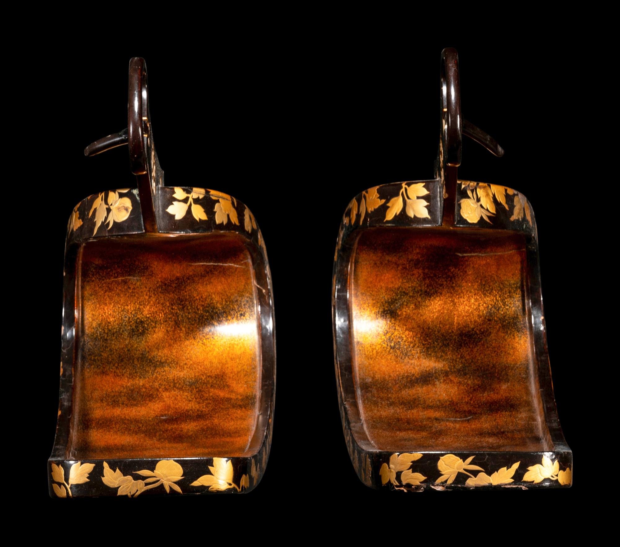 A Pair of Japanese Gold and Black Lacquered Stirrups