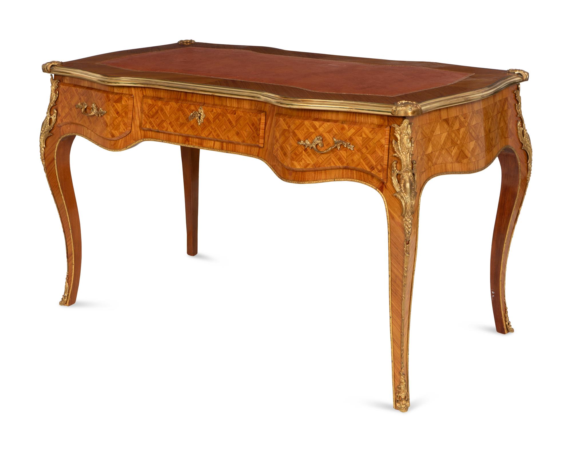 A Louis XV Style Gilt Bronze Mounted Parquetry Bureau Plat and Regency Style Parcel Gilt Chair